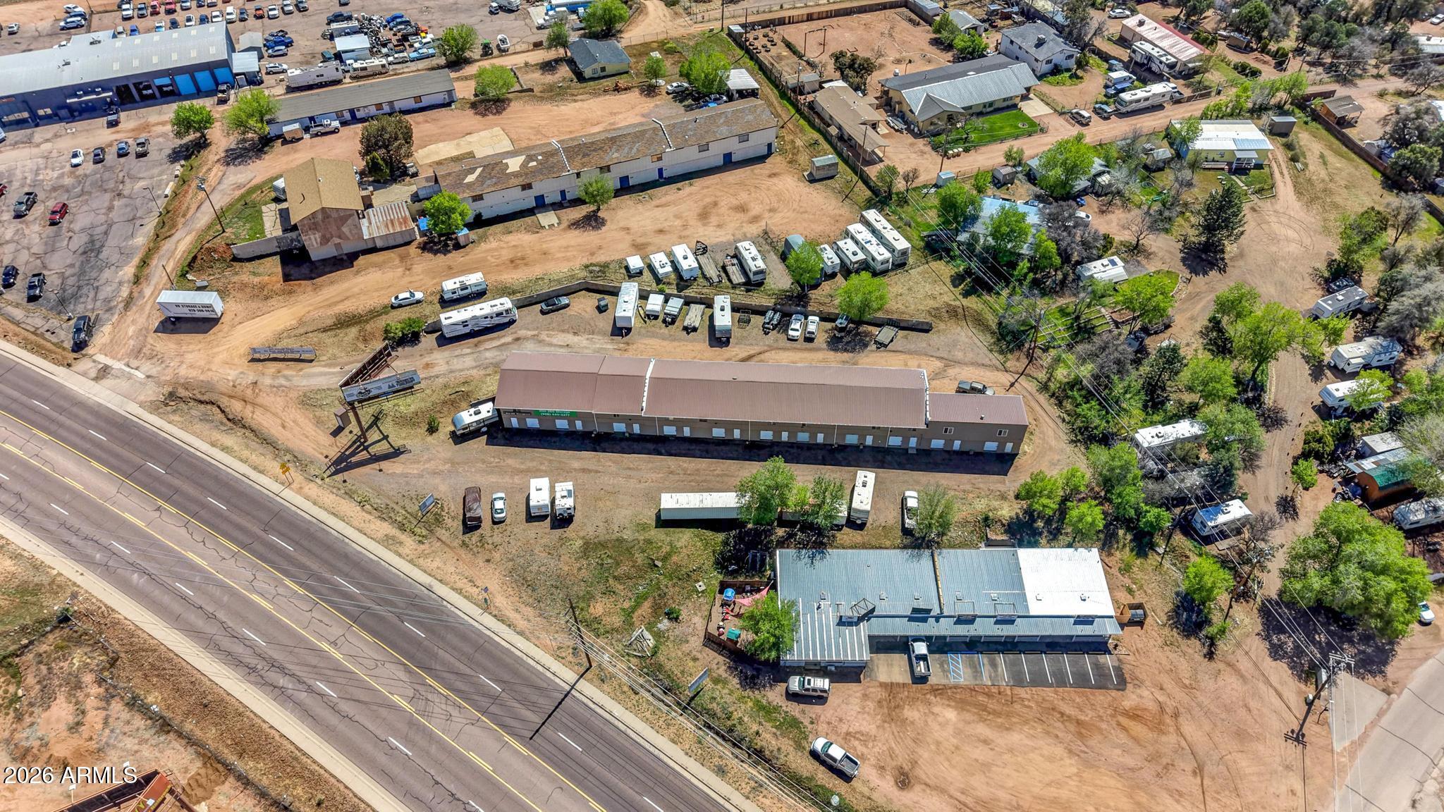 Rim 260 Storage is a well-positioned commercial mini storage and RV facility offering an attractive investment opportunity just minutes from Payson in the rapidly growing Rim Country market. Located along State Highway 260, the property benefits from excellent visibility, easy access, and consistent drive-by traffic, making it a convenient and desirable option for both local residents and seasonal visitors. The facility features a balanced mix of self-storage units and RV/vehicle parking, providing multiple income streams and strong, diversified tenant demand. The property is well-suited for efficient operation while also offering flexibility for future improvements. Existing on-site structures provide additional income potential or adaptive use, enhancing the overall revenue profile. With solid in-place occupancy and continued population growth in the surrounding area, demand for storage remains strong and stable. This asset presents a clear value-add opportunity for investors through potential rent increases, improved management, or physical expansion of additional units or parking. Its strategic location, multiple revenue sources, and upside potential make Rim 260 Storage an ideal investment for buyers seeking dependable cash flow with long-term growth in a high-demand Northern Arizona market.