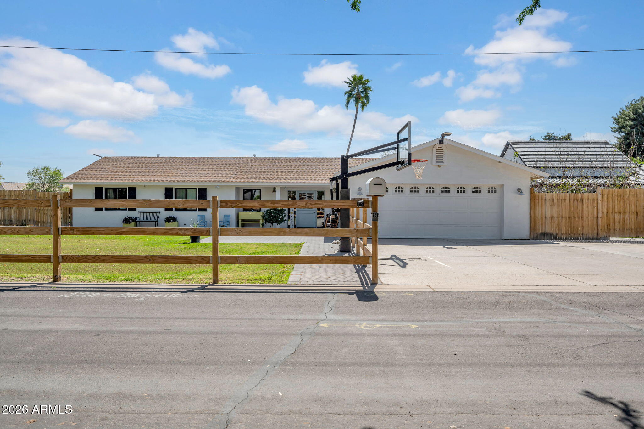 Rare opportunity to own a fully remodeled farmhouse on 1.5 acres near Downtown Gilbert. Updated in 2021, this thoughtfully designed home offers nearly 2,700 square feet with 3 bedrooms, 2 bathrooms, and a bright open-concept layout filled with natural light from Andersen windows and doors, complemented by quality wood flooring throughout.
The chef's kitchen was designed for both everyday living and entertaining, featuring quartz countertops, extensive cabinetry, a 12-foot island with a secondary sink, 36-inch farmhouse sink, KitchenAid stainless steel appliances including double ovens, oversized refrigerator/freezer, Scotsman nugget ice maker, and a dedicated coffee bar.
The spacious primary suite offers a true retreat with dual vanities, soaking tub, oversized rain shower, and a large walk-in closet.
Built with efficiency and comfort in mind, the home includes spray foam insulation, dual high-efficiency AC units, tankless water heater, whole-home water purification and softener system, and a 400-amp electrical panel with capacity for both the home and workshop.
The backyard is designed for both relaxation and recreation, featuring 5,000 square feet of artificial turf with a 4-hole putting green and a refinished 30,000-gallon diving pool complete with baja step, PebbleTec finish, umbrella sleeves, and a saltwater system.
The fully fenced property includes over 30 mature fruit trees, a raised garden, and flood irrigation. A 3,500 square foot workshop offers incredible flexibility with three insulated, air-conditioned rooms ideal for hobbies, storage, or workspace.
Additional features include a 2,000-gallon septic system allowing for future expansion and private access to the SRP canal for walking, biking, horseback riding, or fishing.
With room for horses, livestock, and endless possibilities, this property offers the perfect blend of modern farmhouse living, privacy, and space... all just minutes from the heart of Gilbert.