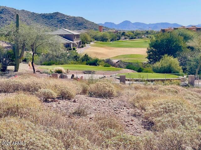 Rare custom homesite opportunity in the quietest enclave of Gold Canyon East. This exceptional lot captures breathtaking views of Gold Canyon Golf Resort, iconic Dinosaur Mountain, and the majestic Superstition Mountains. Surrounded by some of the most dramatic desert scenery in the area, these premier lots are among the most spectacular remaining in Gold Canyon. The natural topography provides the perfect canvas to design a custom home that maximizes sweeping vistas, privacy, and stunning Arizona sunsets. Two custom home plans are available, offering a seamless starting point to bring your vision to life.
Opportunities to build in a setting this extraordinary are becoming increasingly rare in Gold Canyon.