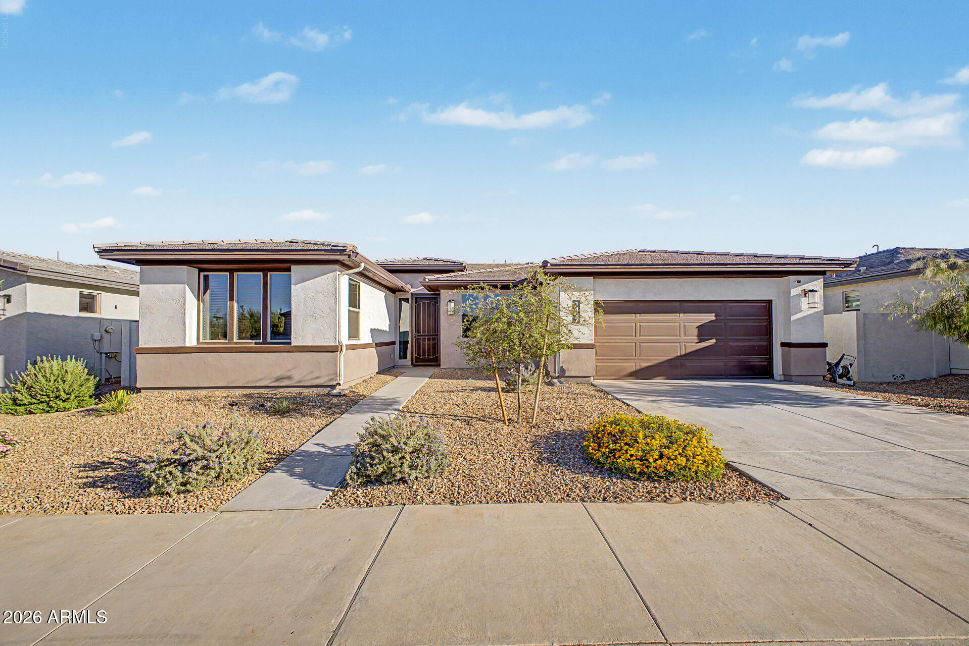 Best value in the neighborhood--packed with upgrades and priced to move. Seller is offering buyer concessions or a rate buy-down, creating an incredible opportunity to lock in a lower monthly payment. Situated on a premium lot and just a short walk to the community amenities, this home delivers both location and lifestyle. The thoughtfully designed Sedona model has a layout that features 2 bedrooms + a den and 2.5 baths, with a bright open great room ideal for entertaining and a split floor plan that offers privacy for guests. The kitchen is dialed in with 42'' cabinetry, modern tile backsplash, soft-close drawers, SS appliances including a gas cooktop, Granite countertops, and a large island great for hosting. Sliding glass doors open to a covered patio, artificial turf landscaping, along with a private pool by Presidential Pools, perfect for relaxing or entertaining year-round.
The primary suite is a true retreat with direct laundry access and a spa-like bath featuring an oversized tiled shower, dual sinks, and a dedicated vanity space. The guest suite includes its own private bath, perfect for visitors. Ovation at Meridian offers a gated, resort-style lifestyle with a clubhouse, fitness center, arts and crafts, heated pool and spa, pickleball, tennis, bocce, golf practice areas, and miles of walking paths.