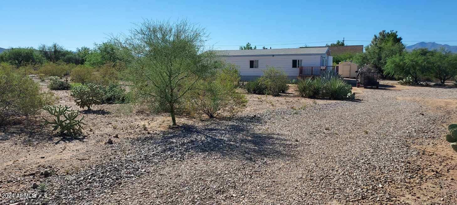 Seller will pay some Buyer Closing Costs! Beautiful Views! Feel like you are so rural yet it's a quick trip to all schools, shopping & workplaces. This home sits pretty on over an acre of land with natural desert flora and fauna. Fresh new carpet in the main bedroom and an all new on suite bath. New appliances. Convenient living room, dining area and kitchen configuration. Large, shaded patio area off the back door. Perfect for gatherings.