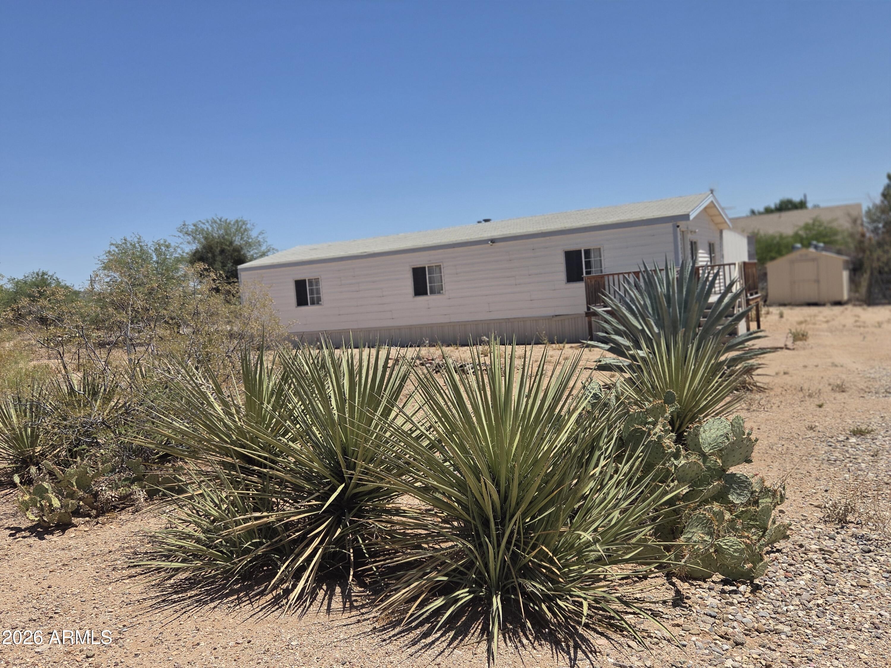 Seller will pay some Buyer Closing Costs! Beautiful Views! Feel like you are so rural yet it's a quick trip to all schools, shopping & workplaces. This home sits pretty on over an acre of land with natural desert flora and fauna. Fresh new carpet in the main bedroom and an all new on suite bath. New appliances. Convenient living room, dining area and kitchen configuration. Large, shaded patio area off the back door. Perfect for gatherings.