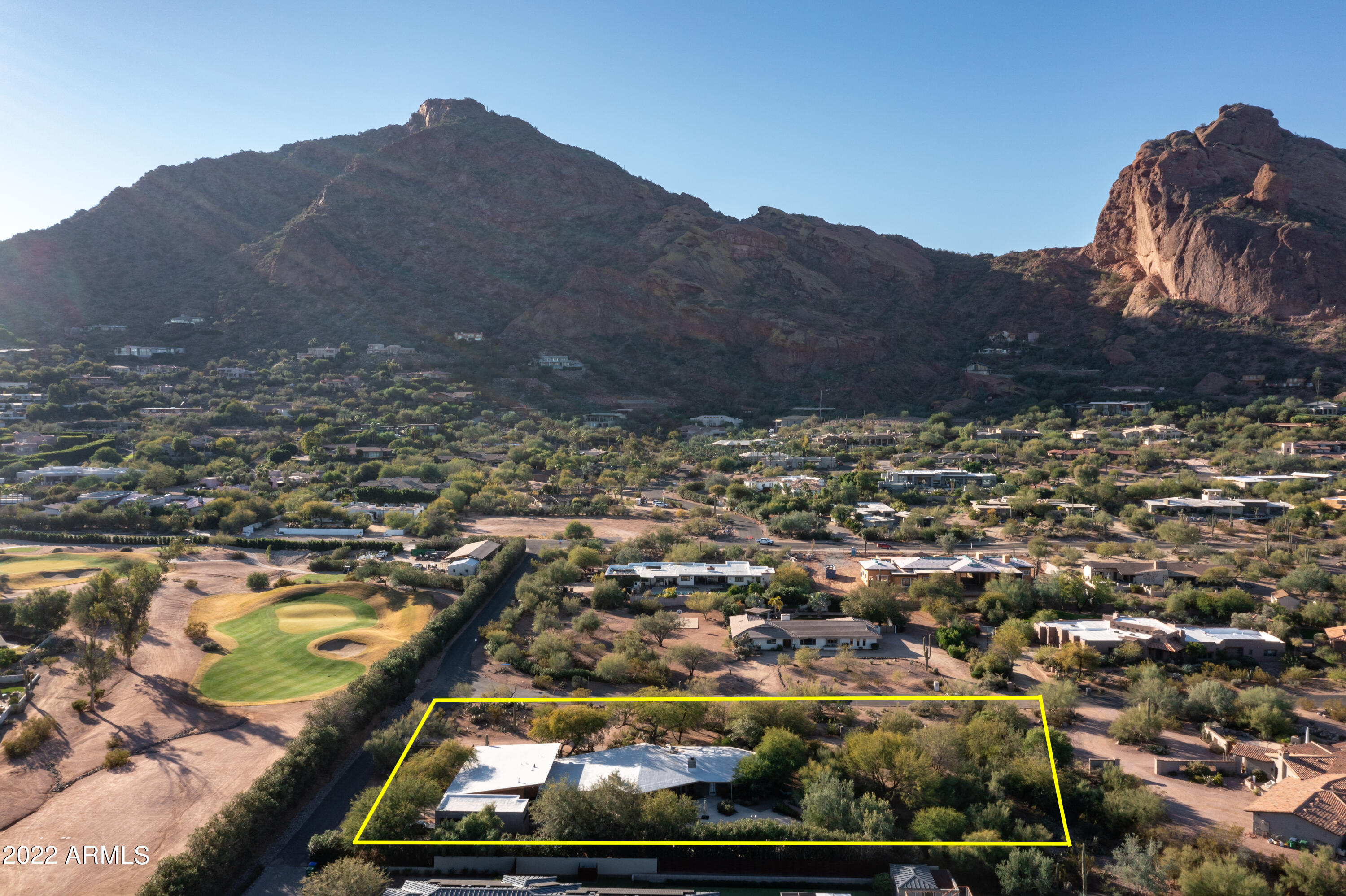 Sitting on 1.3 VERY PRIVATE ACRES with ABSOLUTELY SPECTACULAR VIEWS OF THE FULL CAMELBACK MOUNTAIN. This 4 bdrm, 4,350 Sqft Mid-Century Modern home is on a quiet end st w/ no homes to the East + w/in walking distance to the coveted Sanctuary Resort. The living room, family rm + master bdrm are huge. The light filled residence includes rift-cut white oak+textured concrete flooring, custom hand-made wood slated ceilings + angular Douglas fir windows.The 3rd car garage is used as a workshop.Large Zen grounds w/ specimen desert flora throughout the property. 
The property has been renovated + expanded in the past but could use updating: ex, larger kitchen, master closet + bathrm + updated pool, etc.(interior photos are from the prior owner).Also a wonderful opportunity to build your dream hom