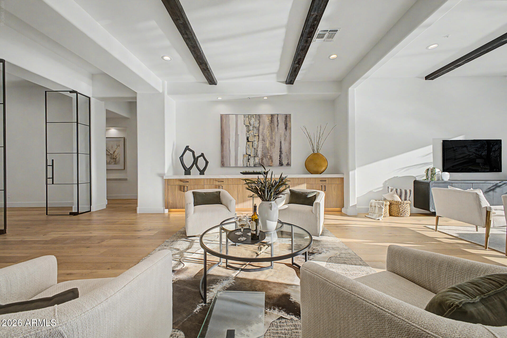 Brand new 2026 high-end luxury remodel in North Scottsdale! Blending California contemporary finishes with a sophisticated Southwest touch, a premier boutique custom builder and interior designer have reimagined this magnificent estate. Designed with a minimalist aesthetic, the residence offers refined, inviting living with grand spaces scaled for entertaining. Expansive walls of glass flood the home with natural light, enhancing the warmth and organic simplicity of the design. A culinary masterpiece, chef's kitchen equipped with commercial-grade gas range, 48'' refrigerator, a wine fridge and a dedicated beverage cooler. It features a fully equipped butler's prep station with a private exit to the outdoor kitchen, BBQ island and covered patio, making indoor-outdoor entertaining a breeze. The primary suite serves as a private sanctuary, featuring a 10-foot glass patio door, a multi-head spa shower, and a freestanding soaking tub and a oversized walk-in closet.