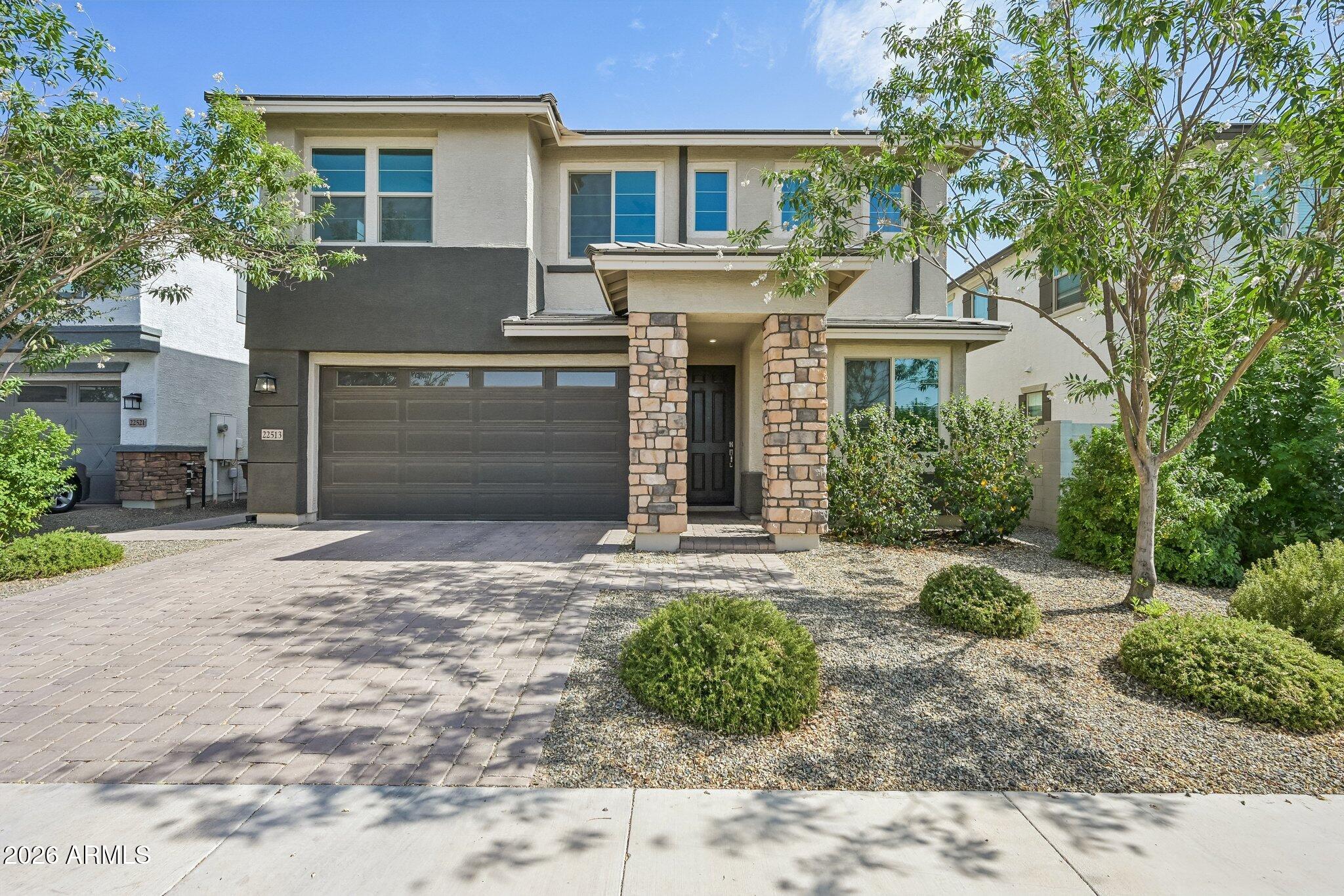 Amazing home in the highly sought after Harvest at Queen Creek.  This desirable Arlington Model is stunning.  Exceptional curb appeal.  From the moment you walk through the front door, you will feel right at home.  First floor features a bedroom, full bathroom, spacious den along with an open concept, great for entertaining family and friends.  The elegant kitchen features gourmet style layout with 42'' cabinets with, stainless steel appliances and quartz countertops.  The 2nd floor features a spacious loft, laundry room, 3 secondary bedrooms and an expansive primary bedroom with an ensuite you would adore.  Enjoy countless sunsets from your rear covered patio overlooking your beautiful backyard featuring pavers and artificial turf.