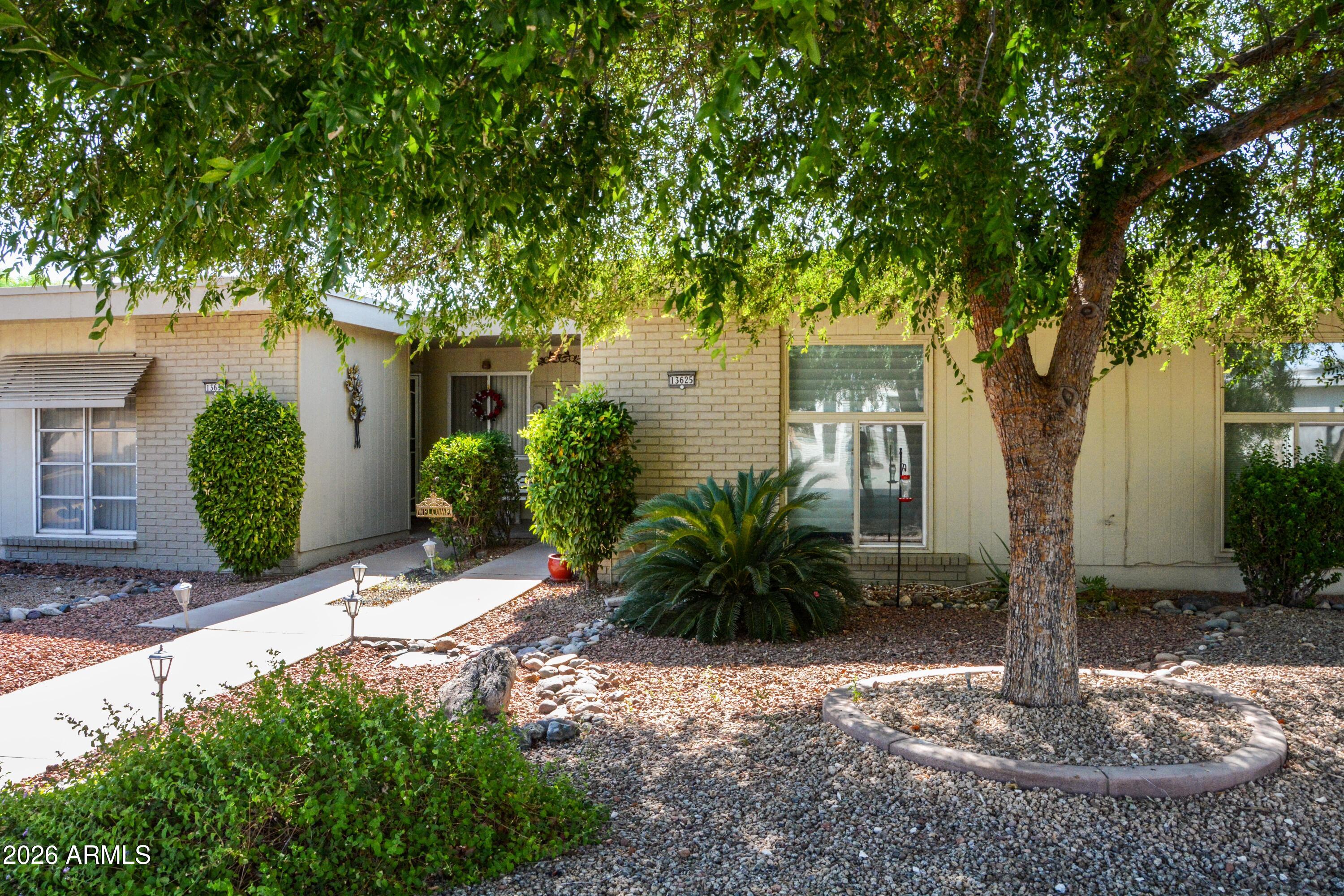 This updated townhome is loaded with great features! This home has 2BR/2BA/1 Car Garage, 1,377 sf and was professionally expanded, making the great room approx. 23' X 19'.  The home has been updated in recent years starting with the kitchen, which features beautiful cabinetry, granite counter tops, and stainless appliances, including a dishwasher.  The dining area is adjacent to the kitchen and approximately 9 x 11.  There is also space in the front of the kitchen for a small table.  Both the primary bath and the guest bath have also been updated. The covered patio is approx. 14' x 17' and has a roof constructed of walk-in refrigeration panels to reduce solar gain.  The material is so strong you can walk on it.      

The flooring has also been updated with laminate flooring.  The most recent was primary bedroom flooring was changed in 2026.

If you are looking for a Sun City condo/townhome, this is a MUST SEE!