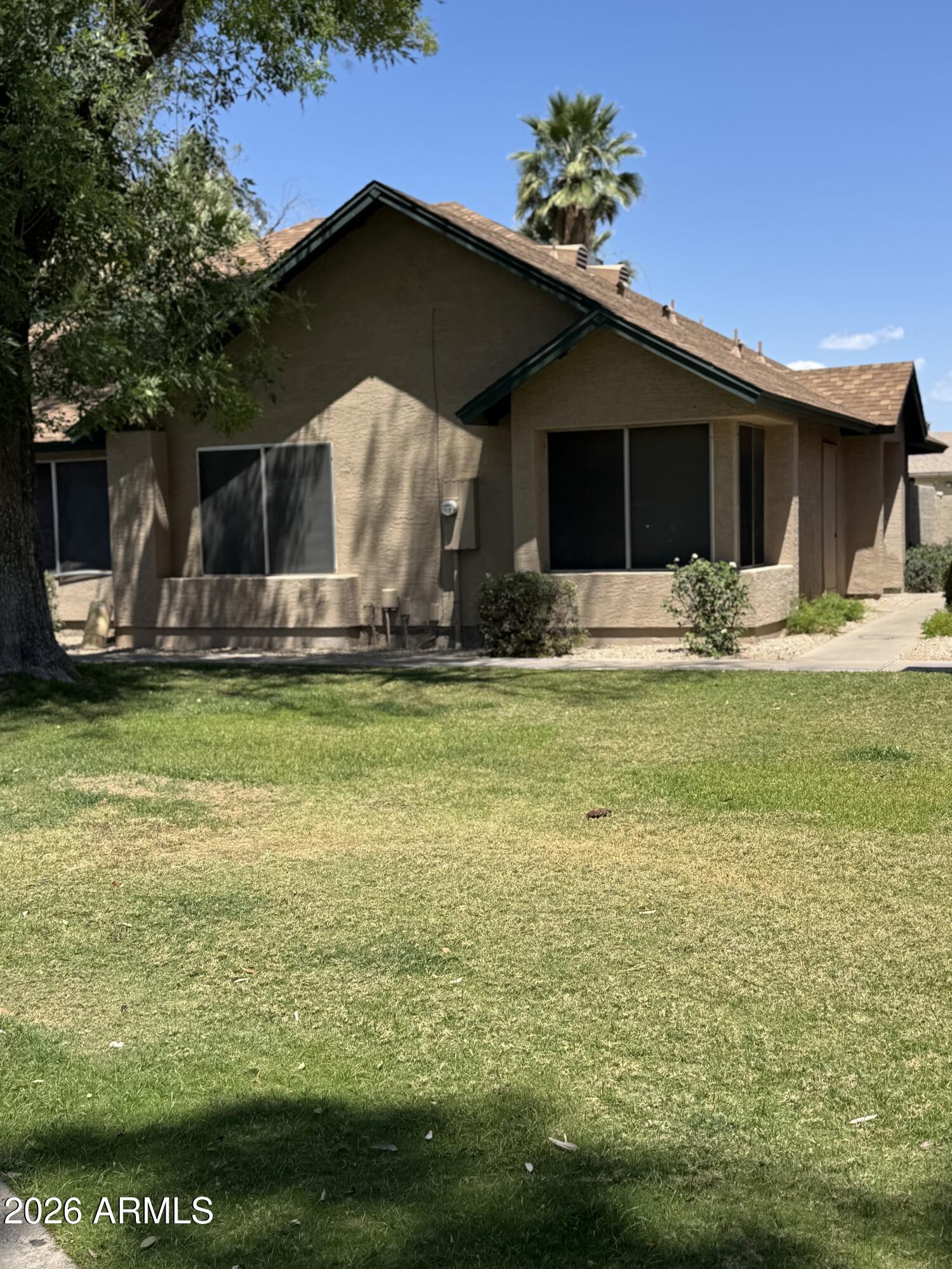 Great single level townhouse, with a prime location within Terrace Green.  North/South Exposure.  Two Bedroom/Two Bath with a private patio/grass area.  Grass in front.  Needs just a little TLC; to be your special home.  All appliances are included.  Two closets in the Primary Bedroom. Community pool and spa very close for ease. Charming smaller complex. Priced accordingly for TLC required.