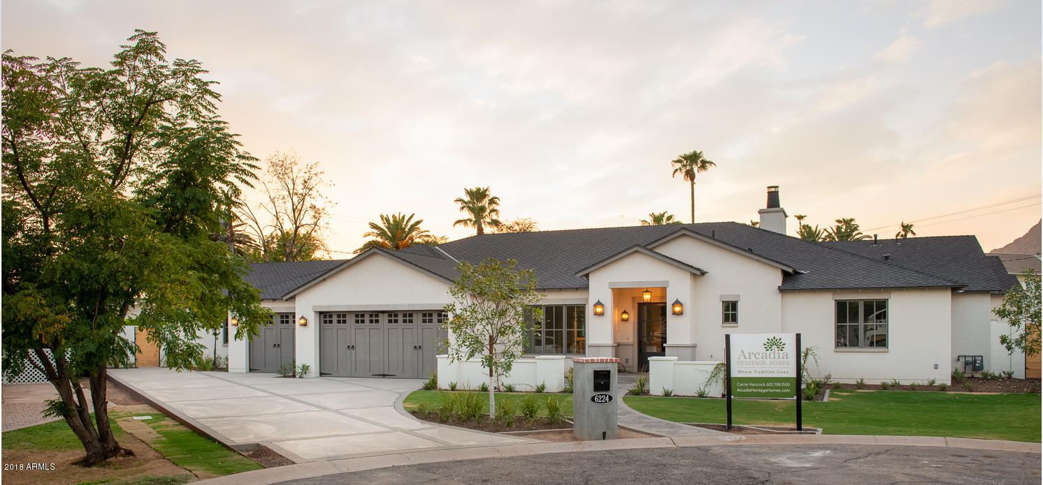 Situated on a 22,000 square foot lot in the back of a cul-de-sac, this stunning new build by Arcadia Heritage Homes is a fresh take on the ''modern farmhouse''. The flexible, open floor plan created by Kent Architects combined with top of the line finishes and design details from H Ryan Studio make this home a true stand out.  This home is loaded with impressive features including vaulted ceilings, an inviting great room with chef's kitchen, a gorgeous butler's pantry, custom cabinetry and beautiful millwork.  The spacious split master retreat features a lovely sitting area with private exit, serene, yet bright, master bath and generous divided closet. The secondary bedrooms are large and include en suite bathrooms. A huge bonus/game room, with access to the backyard weds modern family living with flexible entertaining space.  The expansive back yard, with Camelback Mountain views, includes a large covered patio with outdoor barbecue, tons of grass, an oversized pool and an outdoor fireplace with pergola.  Don't miss out on this beautiful home in the heart of Arcadia!