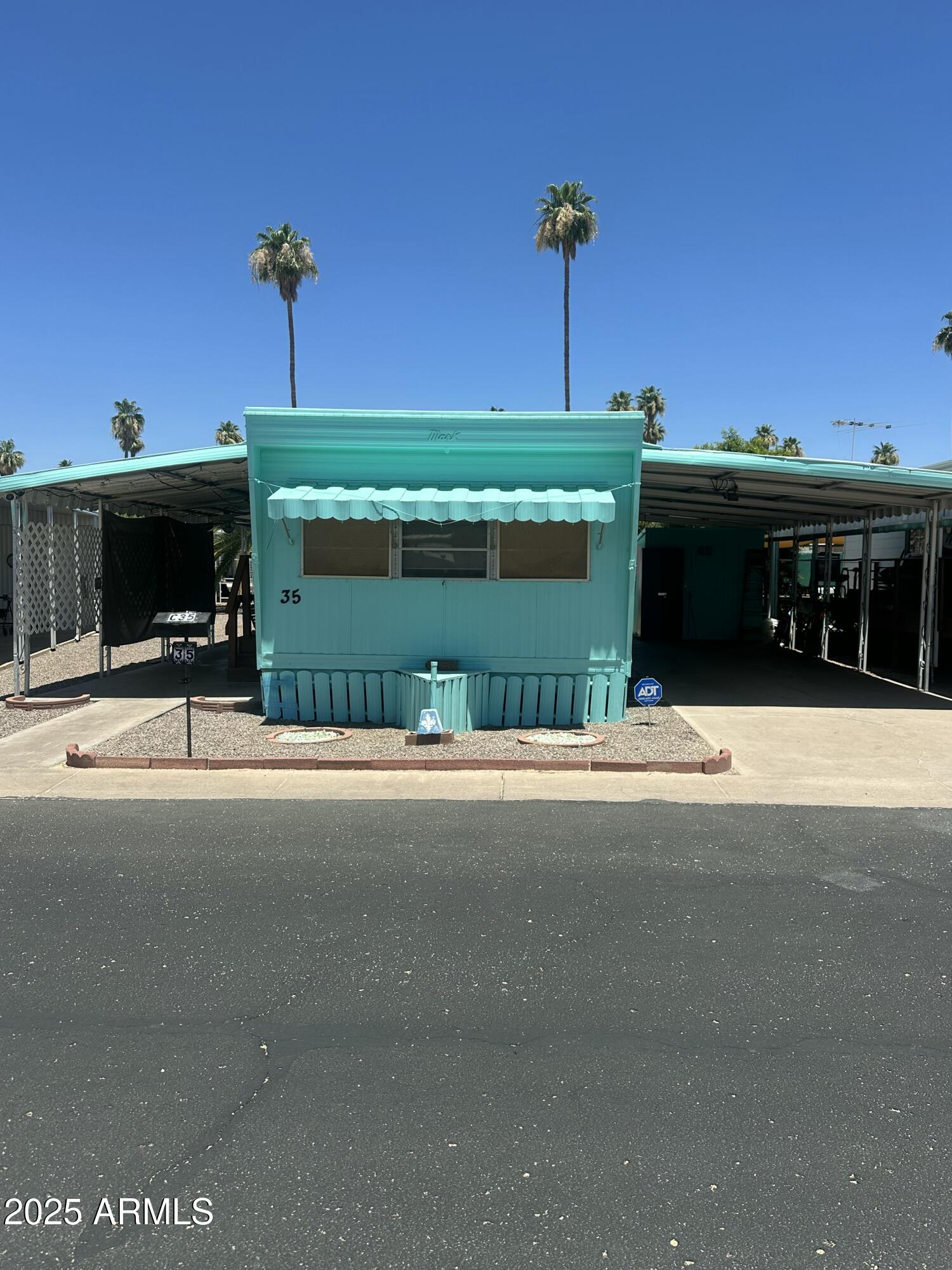 SELLER WILL FINANCE with $2500 down payment. Welcome to Windsor, a PREMIER 55+ gated community offering safety, connection, and an active lifestyle. Residents enjoy the peace of mind of 24/7 security and gated access, along with a vibrant calendar of community events and wellness programs. This LARGE 1 bed / 1 bath home offers comfortable living with a covered patio, covered carport, and a storage shed located under the carport for additional space. The interior has been freshly painted, new refrigerator, new microwave, and new sewer line to the street. The TWO mini split AC is ample cooling for hot summer days. Community offers swimming pool, shuffleboard, and bocce ball.The home also has private covered parking, and convenient laundry facilities