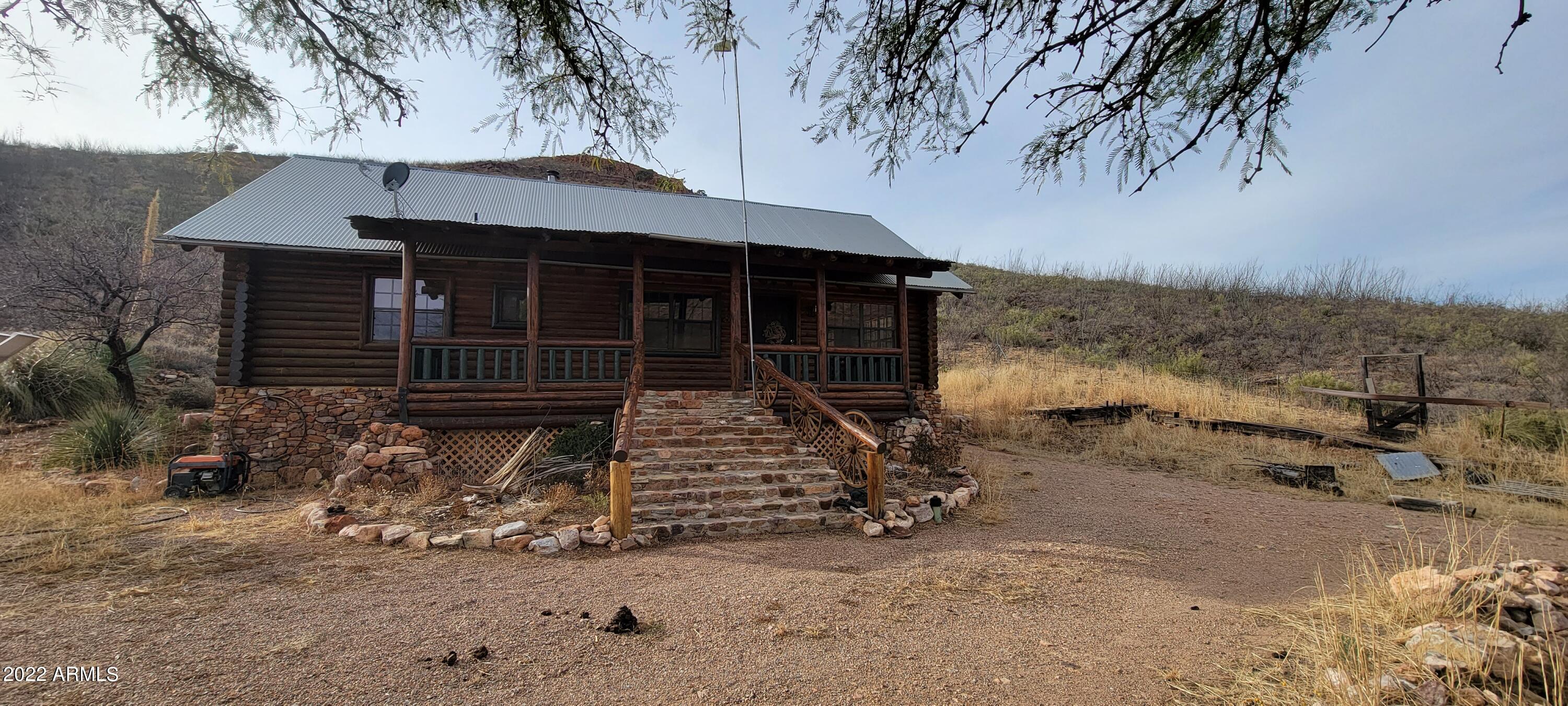 This is the perfect self sufficient getaway in these crazy times! Picture yourself on a mountain side log cabin with the deer and other critters for your neighbors. This home has some owned solar panels and a largely DC electric system for power. There is also an inverter and battery backup. There is a generator that pumps up the water from the well to a large water tank on the hils that gravity feeds the house. The property is partially fenced. The home has a beautiful wood cook stove as well as a gas range. There are gas wall heaters too. The bedrooms do not have closets currently. The sale includes parcels 103-37-013C&D. You will love all the deer, birds, and other wildlife each day! This property will not last. 2/3 well share.