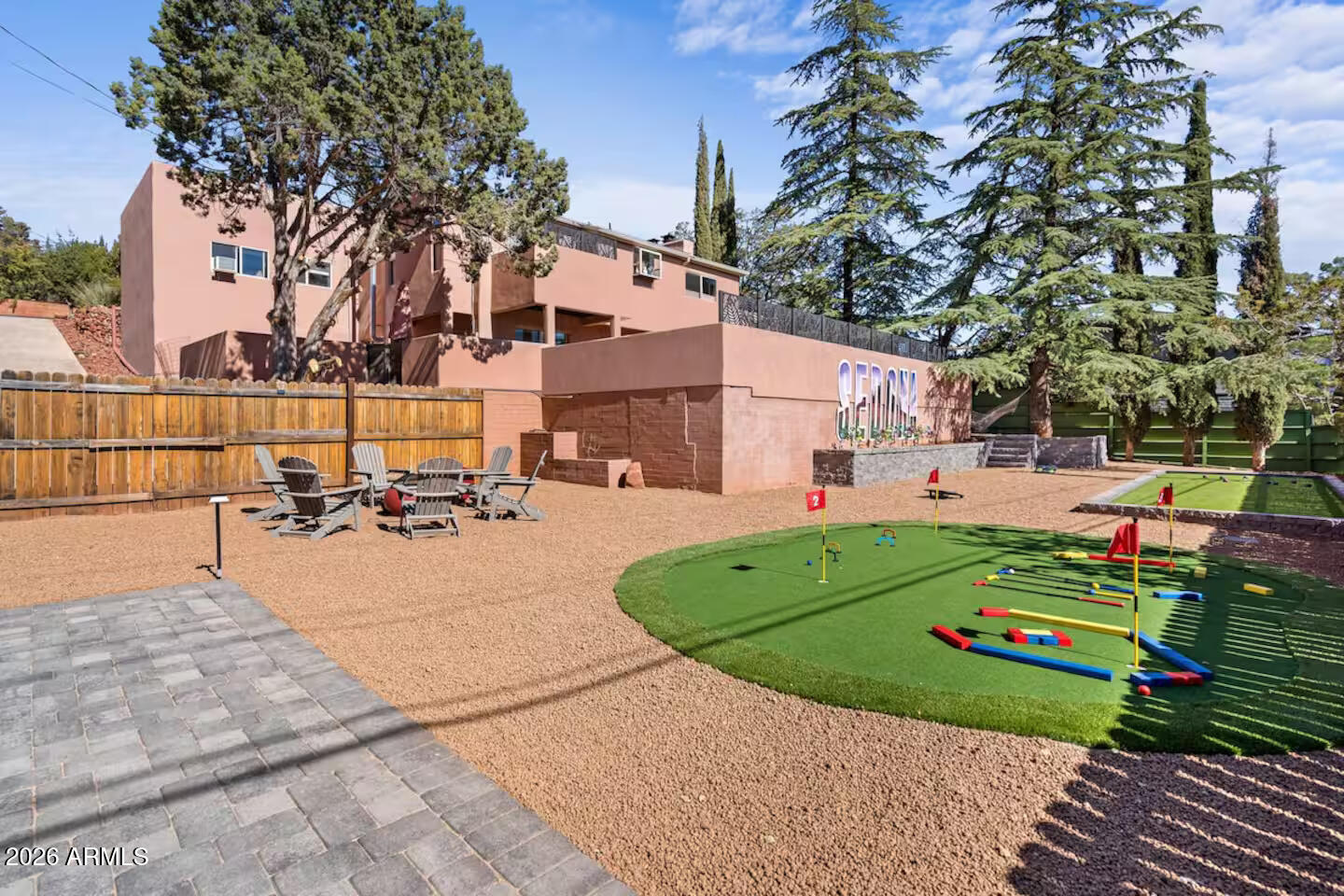 Luxury Sedona retreat: Rose Quartz Playhouse offers a spacious 3-bedroom, 3.5-bath home ideal for up to 8 guests. Two master suites with jacuzzi tubs, open living/dining area, fully equipped kitchen with wine fridge.
Double backyards deliver endless fun: upper level with hot tub, giant chess, dining lounge, gas grill, and stunning red rock views from the deck. Lower yard features private bocce court, putting green (custom mini-golf walls, adjustable clubs), fire pit, covered cabanas, lighted cornhole.

Converted garage game room: pool table, foosball, shuffleboard, 65'' TV for movies/gaming. Smart lock entry w/ 4 yrs of rental history.
Create lasting memories with Sedona's views, activities, and this ultimate playhouse!