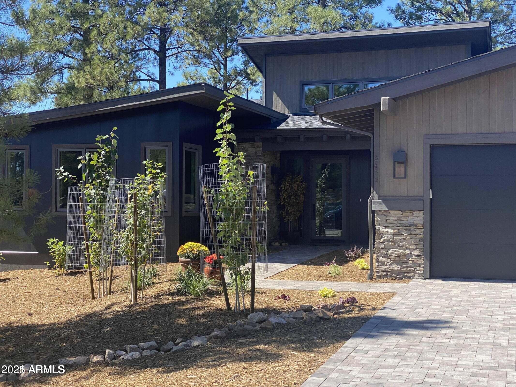 Popular Coconino Ridge in Pine Canyon. Numerous upgrades, including 3 cargarage, extended patio, fireplace in family room lower level Master and 2nd bedroom/office onmain floor.A bove Ground Spa. Beautiful open view of the pines.
