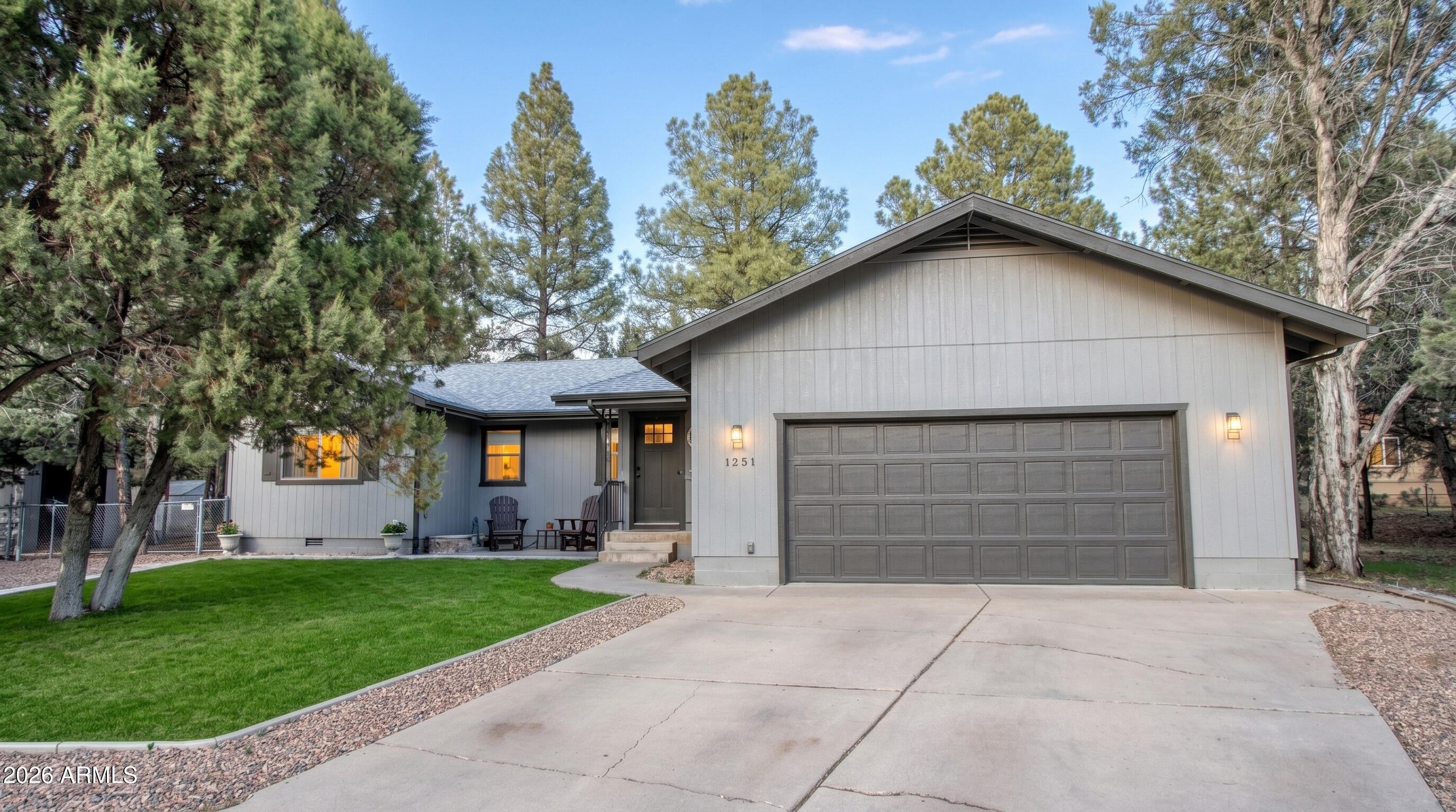 *With an acceptable offer, seller is willing to contribute up to 3% toward buyer's closing costs and/or interest rate buy-down* Welcome home to Country Club Manor ~ w/ NO HOA & a great split floor plan it's a possible Mother in Law set up/ or future rental income W/ its own parking set up/entrance & private yard. This updated retreat is nestled among the tall pines and the property features soaring vaulted ceilings & a fully remodeled kitchen designed to impress. The kitchen is complete with soft-close cabinetry, gourmet kitchen with new countertops, a spacious island, dedicated coffee bar, and a formal dining area, perfect for both everyday living and entertaining. The home offers three generously sized bedrooms, each with larger closet space, along with a charming foyer that opens int Both bathrooms are spacious and well-appointed with tub/shower combinations, while the primary suite is a true standout, recently remodeled to include a luxurious soaking tu walk-in shower w/ stunning subway tile, double vanity and a private water closet. Secondary was updated with new flooring and vanity/mirror. Additional highlights include a spacious two-car garage with separate side exit, Cabinets/workbench, attic storage, plus two versatile utility buildings equipped with electricity--ideal for ATV parking, hobbies, or extra storage. Enjoy outdoor living with three separate patio areas and a fully installed sprinkler system in the front. Located in a highly desirable neighborhood of Country Club Manor, this home offers convenient access to Bison Golf Course, scenic hiking trails, lakes, and local shopping. Don't miss your opportunity to own this exceptional property in a prestigious setting!
