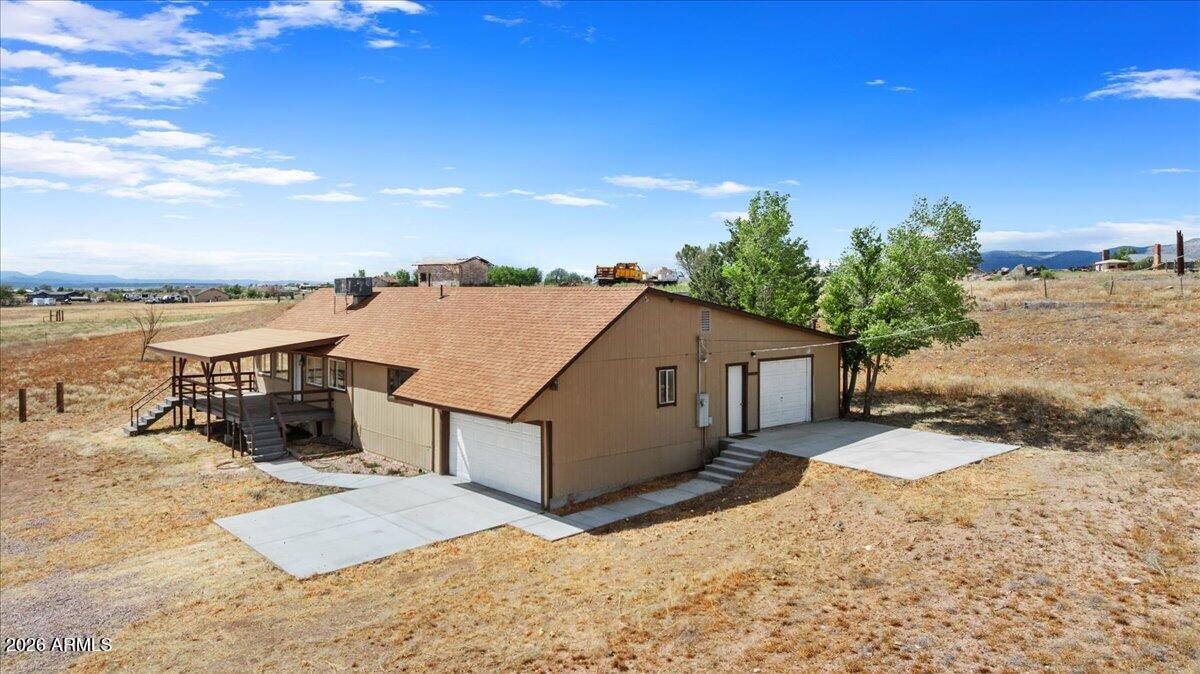 Remodeled ranch-style home situated on 6.75 acres of usable land in Paulden, Arizona. This property features 3 bedrooms, 2 bathrooms, and two garages, offering both functionality and space.

Recent upgrades include a new roof, kitchen cabinets, flooring, and light fixtures, making the home move-in ready. The acreage is fully fenced with pasture, ideal for horses, livestock, or those seeking a farm or homestead setup.

Located on a paved road, the property offers easy access along with privacy and amazing views. Enjoy nearby trails and wide-open space perfect for outdoor living.
