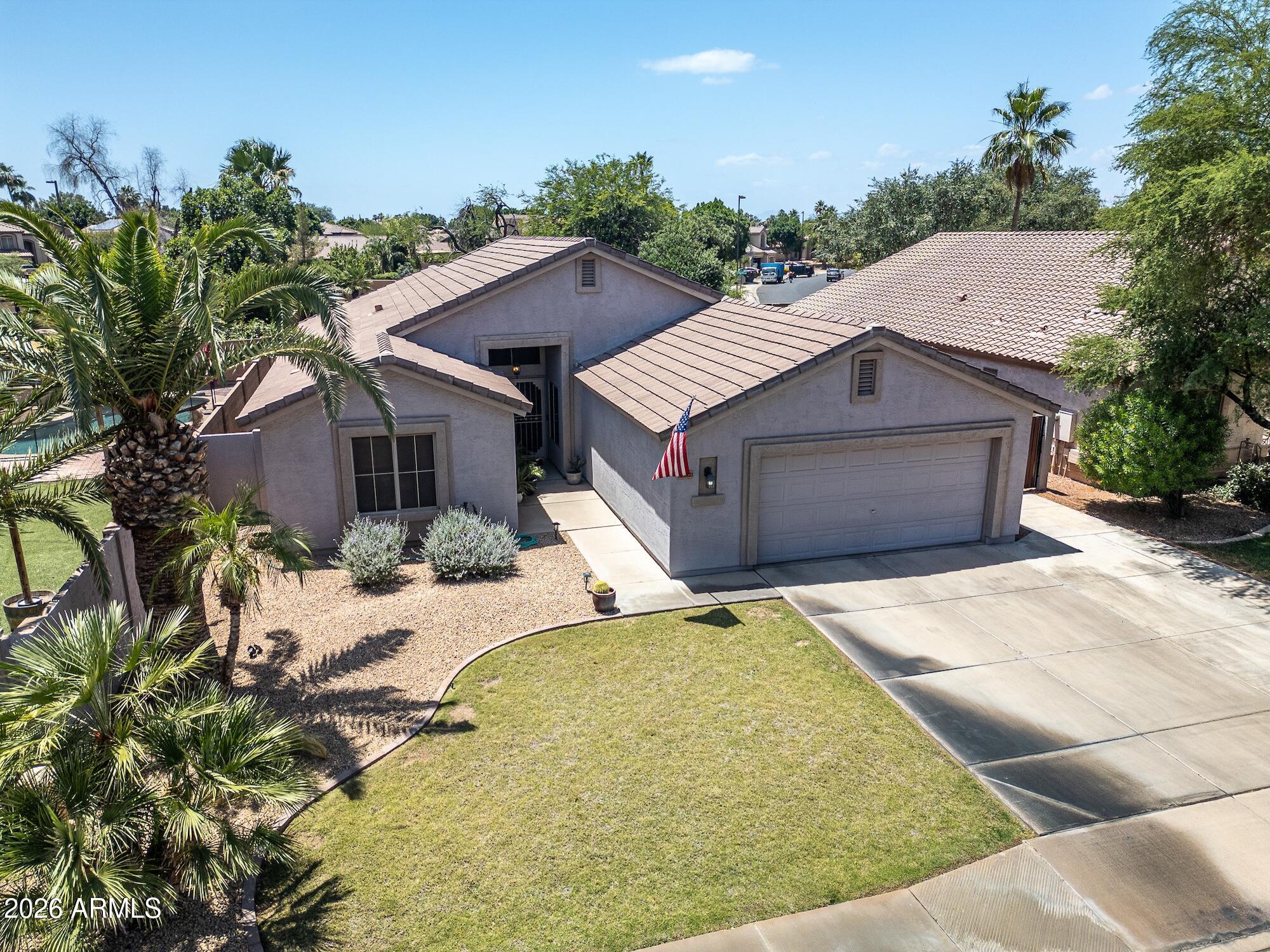 Gilbert home near restaurants, shopping, and entertainment. Thoughtful split floor plan with 3 bedrooms plus a versatile den/home office. The private backyard oasis features a pool and built-in BBQ ideal for Arizona outdoor living. Extra-deep 2.5-car garage with extension gives you the storage space you've been looking for.