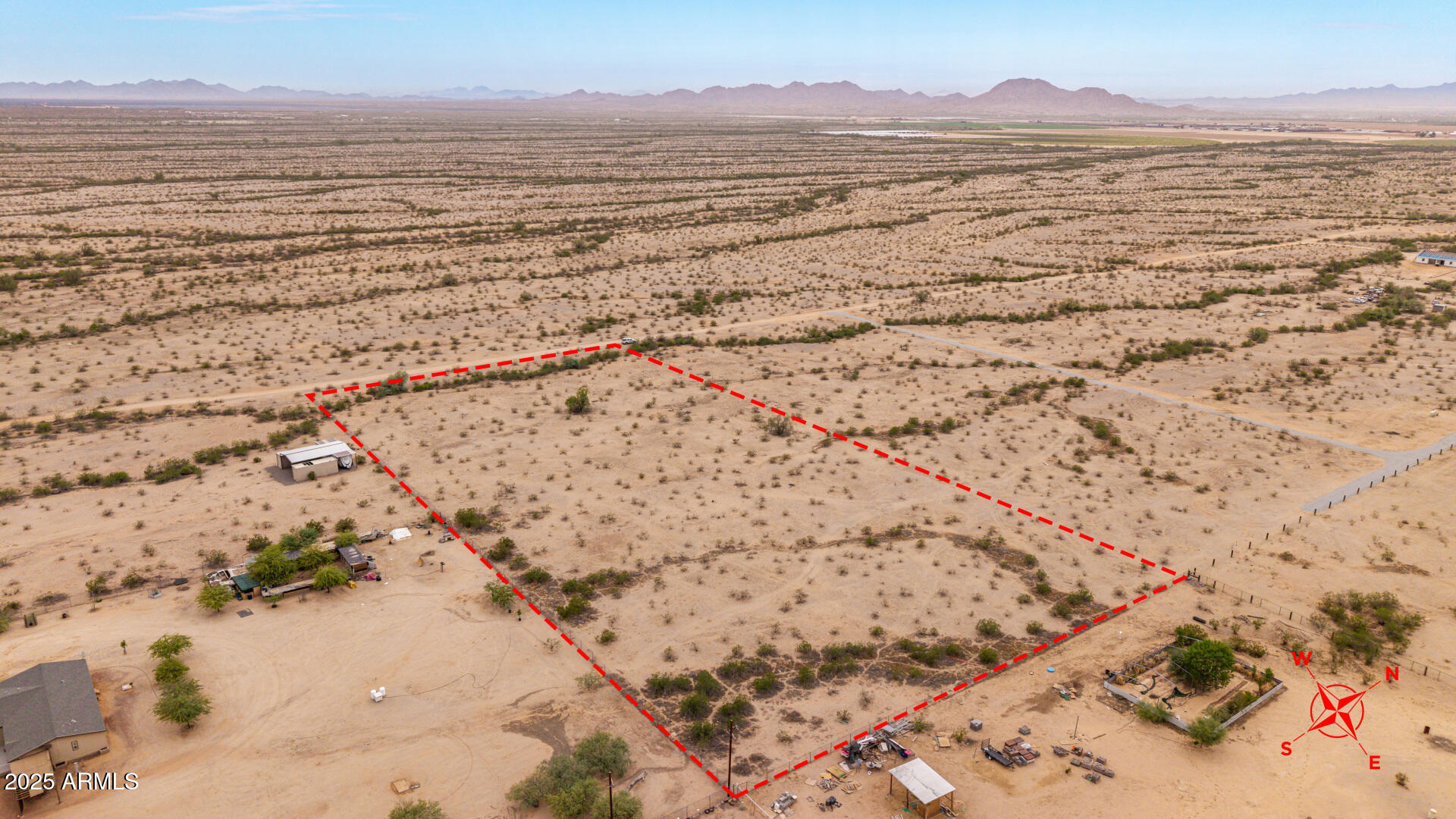Prime investment opportunity in Rainbow Valley Ranch! This 4.47-acre flat, buildable parcel can be subdivided into four 1+ acre lots—perfect for developers, investors, or anyone looking to create multiple homes. With panoramic desert and mountain views, the property offers both privacy and potential. Conveniently located near the future Loop 303, I-11 corridor, and the southern edge of Estrella Mountain Ranch, this land is positioned for growth and accessibility. Build your dream estate, a desert retreat, or capitalize on the booming demand for housing with a multi-home development. Don't miss this rare chance to secure land in one of the Valley's fastest-growing areas!