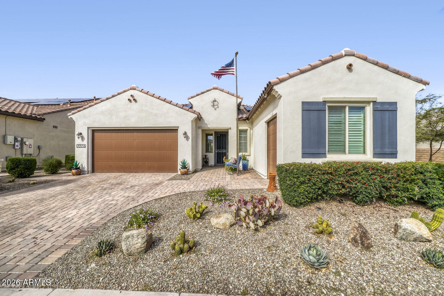 This exceptional 4-bedroom, 3.5-bath home offers versatile living with a private Next Gen suite, complete with its own bedroom, full bath, kitchenette, and den--perfect for multigenerational living, family visits, guests, or extended stays. The main residence features a spacious primary suite with a custom-designed closet and upgraded bathroom. Curb appeal shines with a paver driveway, dedicated golf cart garage, and a prominent front-yard flagpole. Step outside to a resort-style backyard designed for entertaining and relaxation, featuring a sparkling pool, above-ground spa, built-in BBQ, outdoor fireplace, pergola, and gazebo. A stunning rock wall feature and lush landscaping with mature plants create a private oasis perfect for Arizona outdoor living.