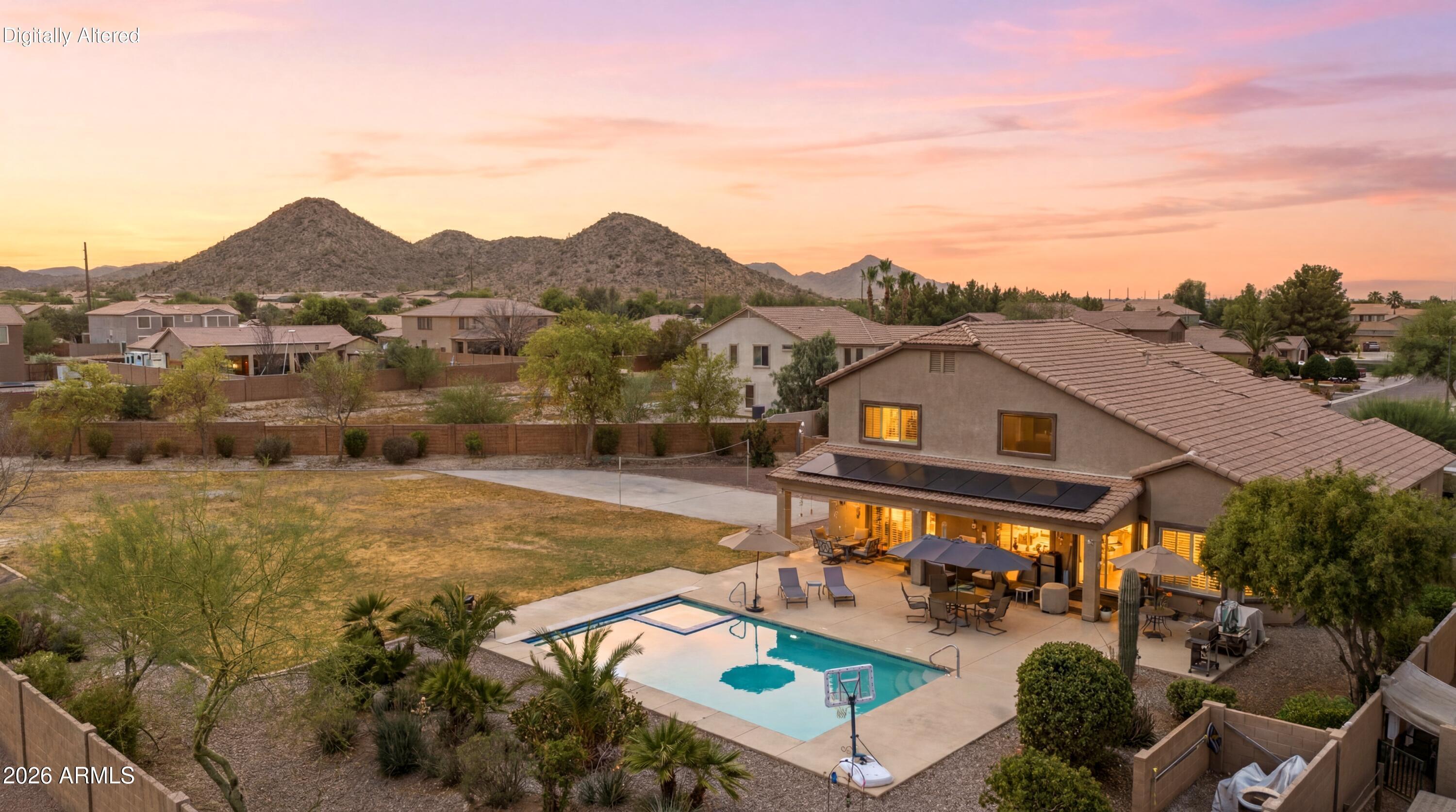 Absolutely stunning and meticulously updated home on a rare 30,740 sq. ft. private lot with endless possibilities! This immaculate 5-bedroom, 2.5-bath home offers over 3,600 sq. ft. with new flooring throughout, new windows and screens, plantation shutters, new insulation, updated ceiling fans, and HVAC/furnaces only 6 years old. The spacious kitchen is designed for entertaining with freshly painted cabinets, new hardware, under-cabinet lighting, double ovens, and beautiful quartz countertops. Primary suite and an additional bedroom are downstairs, with 3 bedrooms and a loft upstairs. Enjoy a heated pool, spa, and automatic pool cover. Oversized backyard offers room for an ADU, RV garage, workshop, pickleball court, or all your toys. 3-car garage. Enjoy Johnson Ranch amenities,
