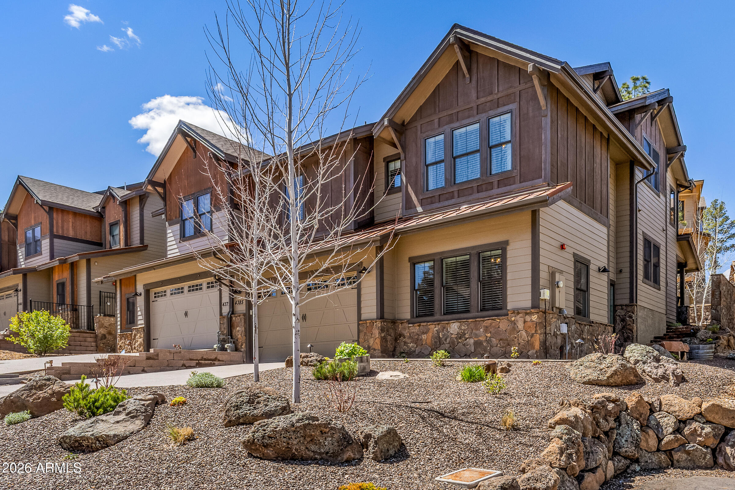 Luxury mountain-modern townhome with gorgeous mountain views in the prestigious Flagstaff Ranch private community, which includes a top-rated Troon-managed golf course. This 3 bedroom, 3 bath home also features a large bonus room/den and loft area, offering flexible living space. Highlights include vaulted ceilings, wood flooring, high-end appliances, wine fridge, and built-in surround sound. Offered as a turnkey home with Restoration Hardware and Crate & Barrel furnishings, all TVs, outdoor furniture, Traeger smoker and snowblower included. The exterior has been updated with new hardscape, lush mountain landscaping, French drains and yard lighting. Also, custom built-in garage cabinets provide ample storage. Exceptional move-in-ready luxury opportunity! Golf Membership offered separately.