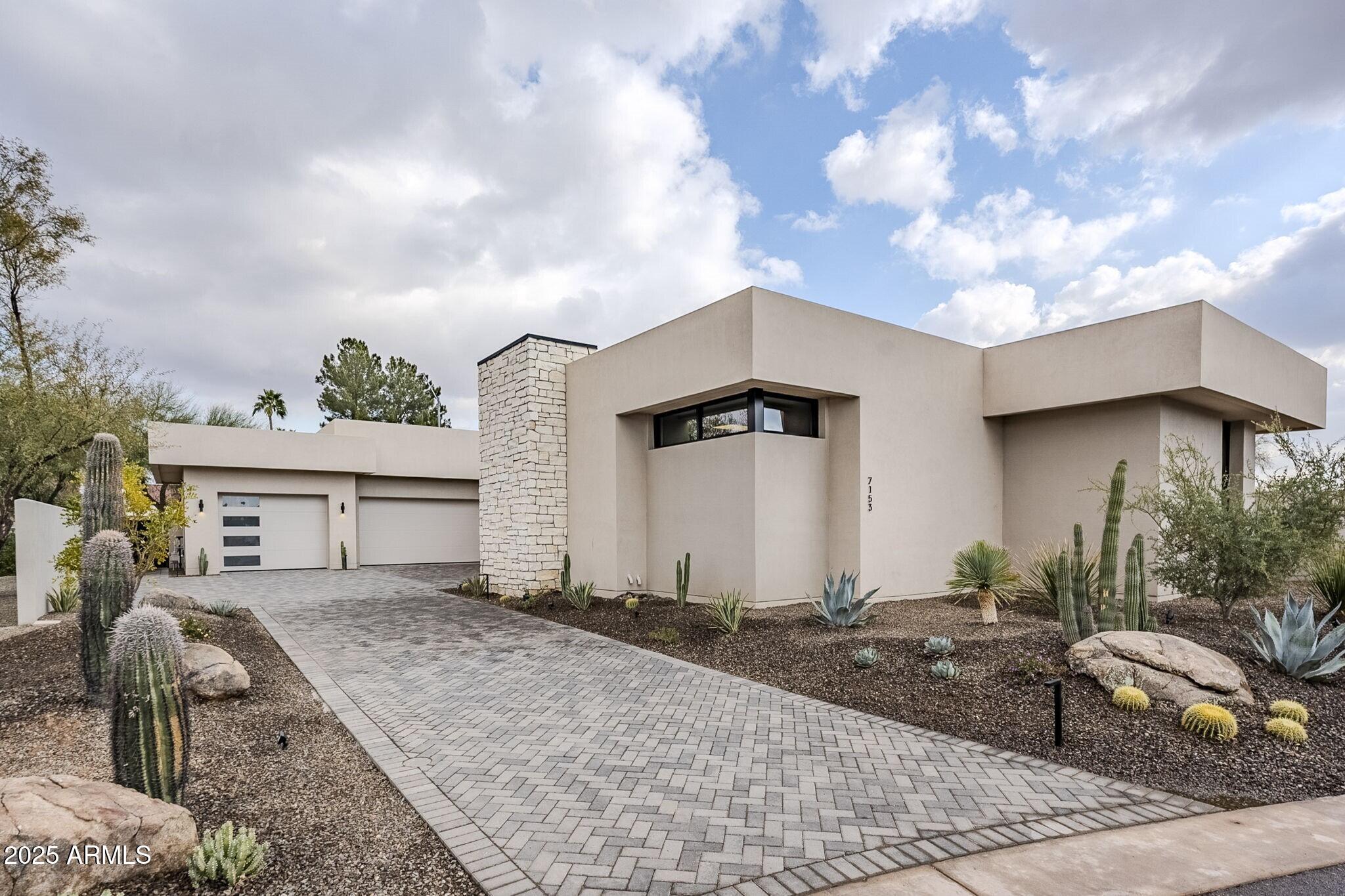 DESERT SANCTUARY! ANOTHER NEWLY BUILT CUSTOM HOME BY CULLUM HOMES! SINGLE LEVEL 4,712 SQ FT FULLY FURNISHED WITH DESIGNER FURNISHINGS READY FOR MOVE IN!  ENTRY THROUGH THE PRIVATE COURTYARD LEADS YOU TO THE FRONT DOOR/WALL OF GLASS. THE CHEFS KITCHEN WITH SUB ZERO/WOLF APPLIANCES, CUSTOM CABINETRY, QUARTZ COUNTERS AND PANTRY WRAPPED IN STONE ALL OVERLOOK THE ENTERTAINING GREAT ROOM WITH AN ENORMOUS CONTEMPORARY FIREPLACE WALL WITH FLOOR TO CEILING STONE, DINING ROOM AND FULL WET BAR AND WINE STORAGE.  THE VIEW OUT THROUGH THE FLOOR TO CEILING WINDOWS TO THE POOL AND MOUNTAINS IN THE DISTANCE IS PEACEFUL. THE SPLIT FLOOR PLAN WITH THE PRIMARY BEDROOM AND OVER SIZED PRIMARY BATH IS IMPRESSIVE.  THE FAMILY ROOM WITH THE WET BAR AND POKER TABLE AREA IS JUST OFF THE 2 EN SUITE GUEST ROOMS. PERFECT FOR COMPANY TO HAVE THEIR OWN SPACE.  THE OFFIC OPENING TO THE COURTYARD IS PERFECT FOR GETTING WORK DONE. THE POWDER BATH, LAUNDRY AND EPOXY FLOORED 4 CAR GARAGE, LARGE ENOUGH FOR YOUR CARS AND TOYS, COMPLETE THE MAIN HOUSE. THE AMAZING COVERED OUTDOOR CHEF KITCHEN WITH BUILT IN BBQ, POOL, SPA AND TOWERING WATER FEATURE CREATES A WONDERFUL FALLING WATER AMBIANCE. ACROSS THE OUTDOOR ENTERTAINING SPACE YOU WILL FIND THE ONE ROOM EN SUITE CASITA WITH A DRY KITCHENETTE WITH BEVERAGE REFRIGERATOR. THIS HOME ALL ON ONE LEVEL IS PERFECT FOR SOMEONE LOOKING FOR THAT RIGHT SIZED HOME. THE PARADISE VALLEY COMMUNITY OF 8 HOMES IS GATED AND CLOSE TO ALL THE SHOPPING AND RESTAURANTS OF YOUR CHOICE. COME SEE THIS HOME TODAY!