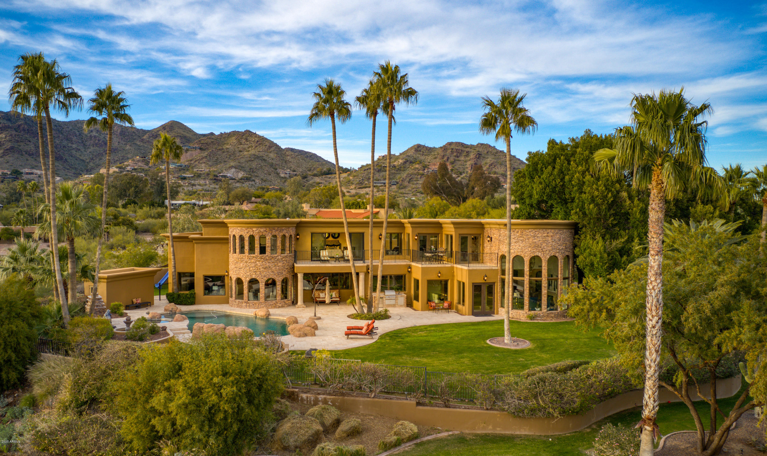 HIGHLY SOUGHT AFTER PARADISE VALLEY ADDRESS NEIGHBORING PARADISE VALLEY COUNTRY CLUB. ENTERTAINERS PARADISE AND GREAT FAMILY HOME WITH STUNNING CAMELBACK MOUNTAIN VIEWS FROM EVERY ROOM. ELEVATED LUSH BACKYARD WITH DIVING POOL, SPA AND OUTDOOR FIREPLACE. EXPANSIVE MASTER RETREAT WITH SITTING ROOM. WAKE UP EVERY MORNING TO CAMELBACK MOUNTAIN FLOATING IN FRONT OF YOU. SIX BEDROOMS INCLUDING ATTACHED GUEST HOUSE. GRAND CANTERA FIREPLACES, WET BAR, GAME ROOM, GYM, AND THEATER. THREE CAR GARAGE WITH AMPLE GUEST PARKING, NEW BUYERS SHOULD EXPECT TO HOST PLAY DATES, IN LAWS, VISITORS ...THIS HOME HAS BEEN THE SITE OF MULTIPLE CHARITY EVENTS AND LARGE GATHERINGS. DRAMATIC FOYER ENTRANCE DESIGNED TO IMPRESS. ALL AT AN EXCEPTIONAL OFFERING PRICE OF $313.00 PER SF. DON'T MISS ''VIDEO'' UNDER ''PHOTO''