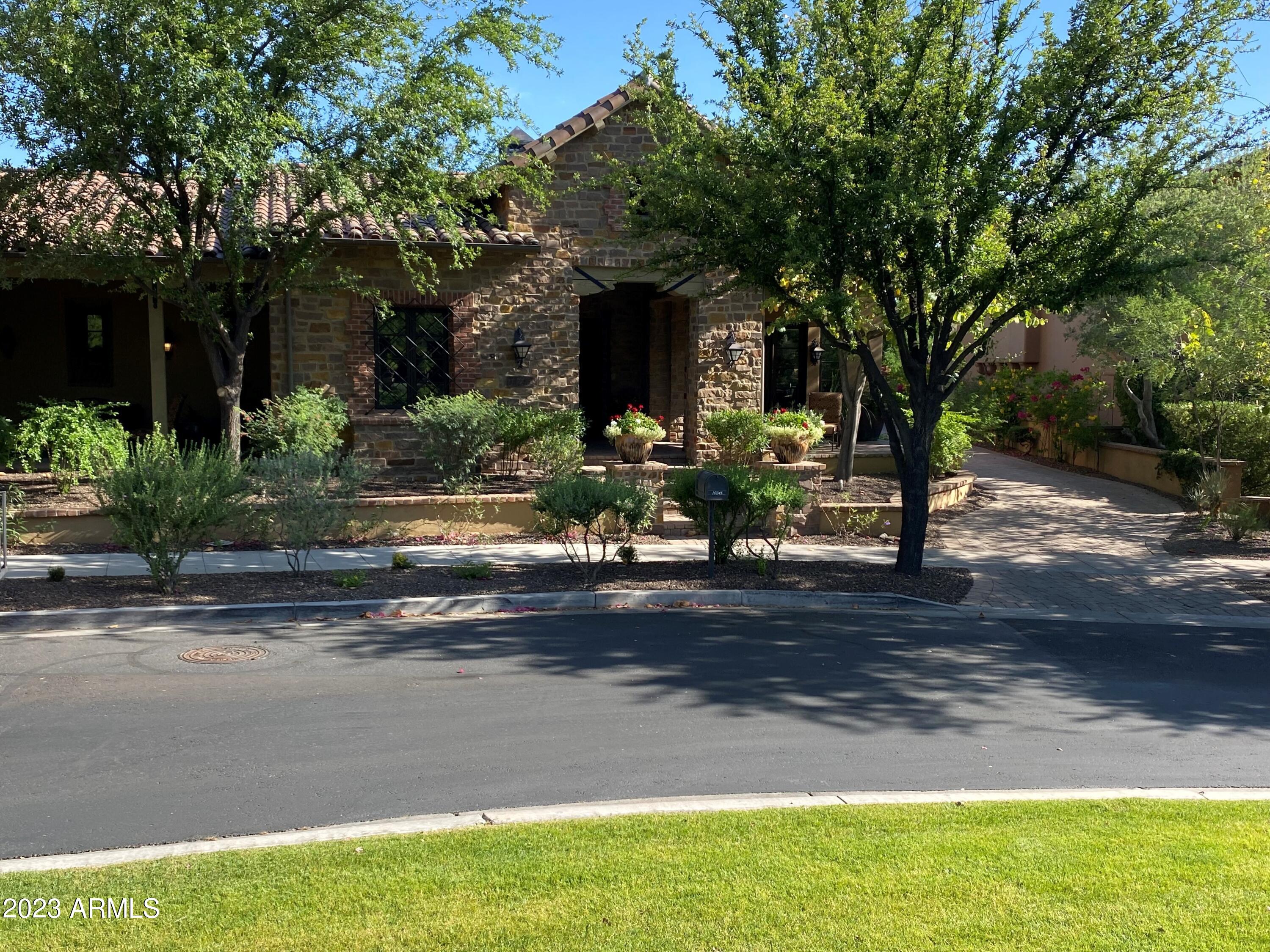 Panoramic mountain views just blocks from the Silverleaf Clubhouse.  This 5,467 sf property fronts a manicured park and has a desirable south-facing backyard. Floorplan has 3 bedrooms plus office and game room on main floor; second level is a guest apartment accessible via elevator with 2 bedrooms/2 bathrooms,  family room/ kitchenette and laundry room.   Great outdoor spaces with pool/spa, firepit and BBQ center in back and additional courtyards and covered patios in front/side areas.  Located in the Horseshoe Canyon gate with easy access to the club facilities and gate.