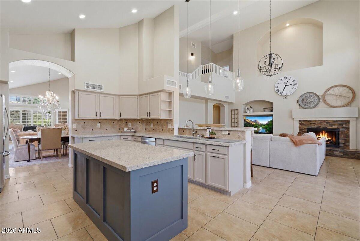 Ahwatukee has a way of surprising people. It's one of Phoenix's 15 urban villages, but it lives like a small town, the kind of place where neighbors actually know your name, turn out for community events, and keep an eye on each other's houses. That's the backdrop for this 4 bedroom, 3 bath TW Lewis home, and if you know Ahwatukee, you know that name carries weight. TW Lewis built for quality, and you feel it the moment you walk in. The primary suite sits on the main level, so there are no stairs at the end of a long day and a smart bit of separation from the three bedrooms up top. The kitchen and baths have already been updated, so you're not inheriting a project. You're walking into a home that's ready to go. Plenty of room to spread out, plenty of room to pull everyone together, depending on what the day calls for.

Out back is where the Arizona summer earns its keep. The pool is the main event, framed by easy care artificial turf that stays green in July and hands you your weekends back. It's a yard made for Sunday cookouts and cannonball contests, minus the mowing.

Then there's the setting. You're walking distance to Desert Vista High, inside the Kyrene and Tempe Union school districts, with charter and private options close by. South Mountain Park, one of the largest city parks in the country, is practically out your back door for hiking, biking, and horseback riding. Golf courses, Phoenix Premium Outlets, restaurants, and shopping sit minutes away, and hopping on the 202 puts you on the east or west side of the Valley before your coffee gets cold.

Last but most least are the outstanding amentities within Mountain Park Ranch! Pools, sports courts, tot lots, 3 locations in the community.

Small town feel, big city access. That's Ahwatukee, and this is your place in it.