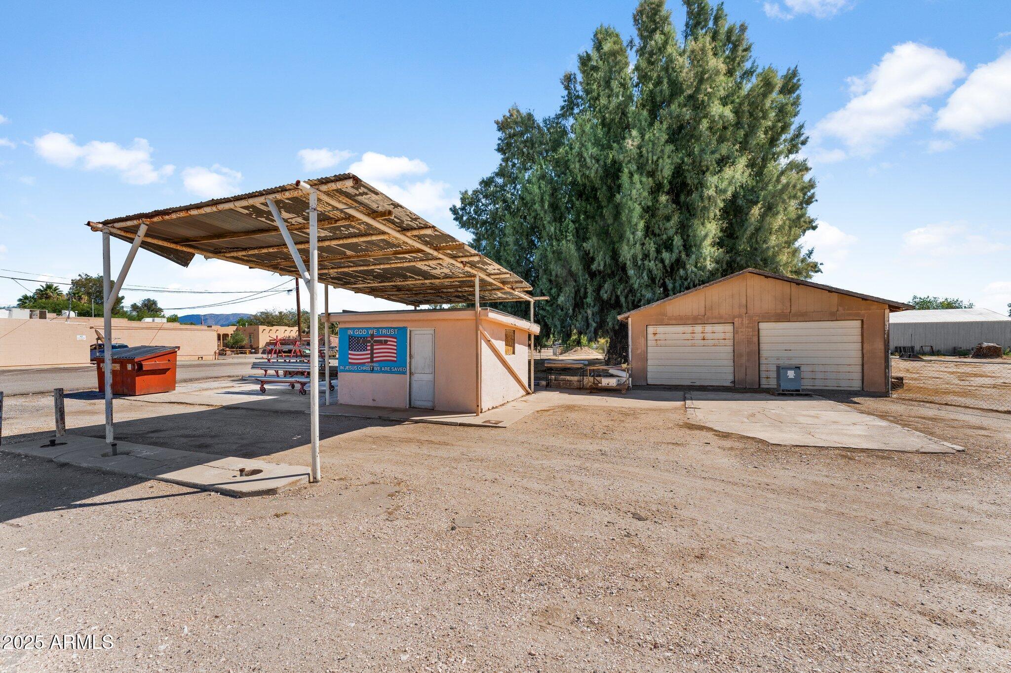 This 1 acre parcel is ready to go with Septic in, power and town water on lot. It has 11 town lots available to use, or set up RV spots. It also includes a detached garage for storage, and the remnants of an old gas station (tanks have been removed). With Hwy 60 frontage, it is an excellent location for a commercial business, mechanic shop, tire store, use your imagination, and make your dreams come true!
