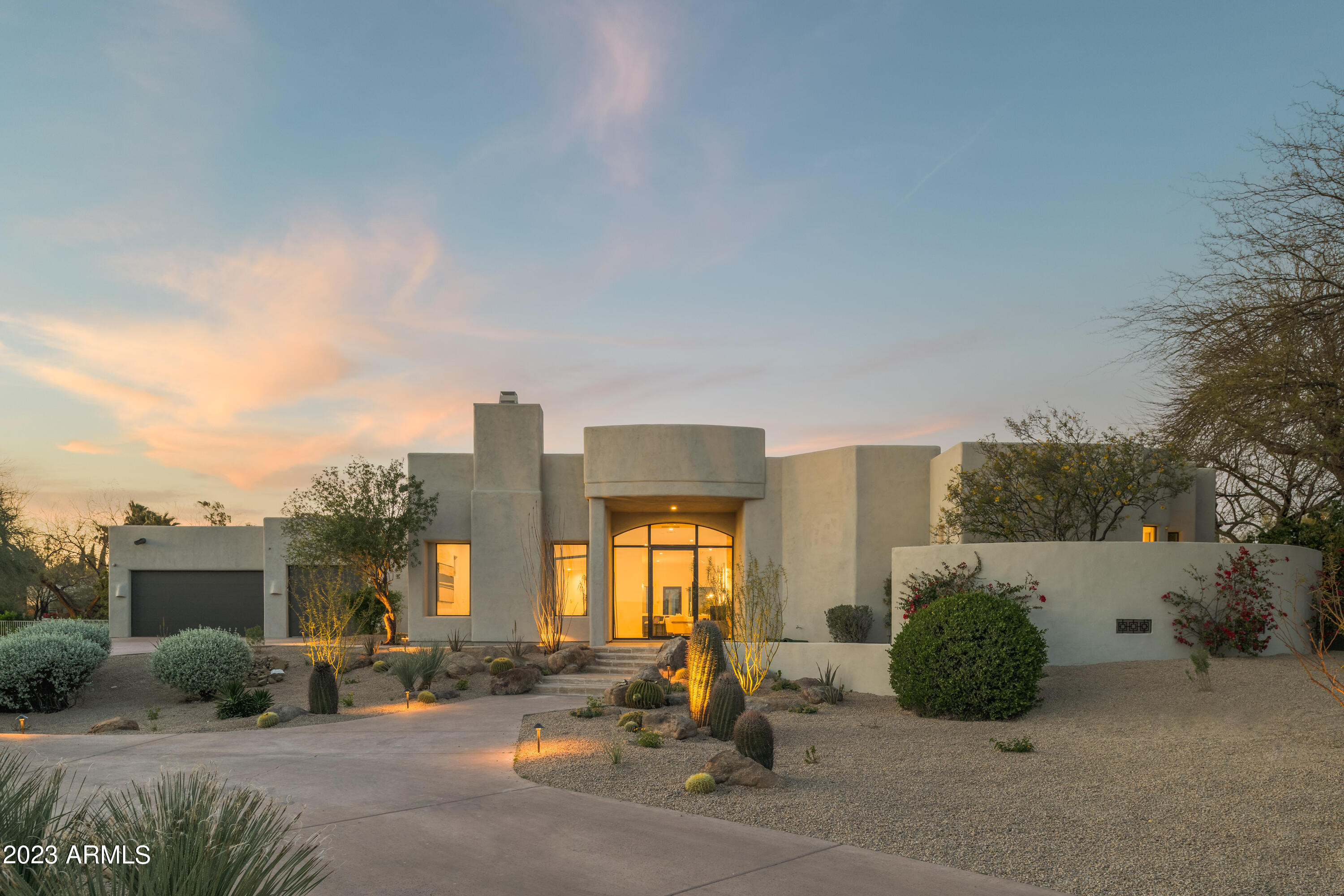 Newly Renovated!! This incredible estate features 5,300 sq ft of living space, situated on a nearly 1-acre site in the prime North Scottsdale Pinnacle Peak Country Club. The expansive Primary Suite features a spa-like bathroom, dual closets, and lounge area with views to the backyard. The open-concept kitchen is outfitted with Thermador appliances, a 12' hood, and is perfect for entertaining with a pass-through window to the backyard. Walk-in pantry with a SMEG fridge compliments the kitchen. Additional luxury living spaces include a temperature-controlled wine cooler, fireplace, and 3 additional spacious and well-appointed bedroom suites. This home also boasts a spacious guest house, with a full-sized kitchen, bathroom, bedroom, and large slider overlooking the pool.