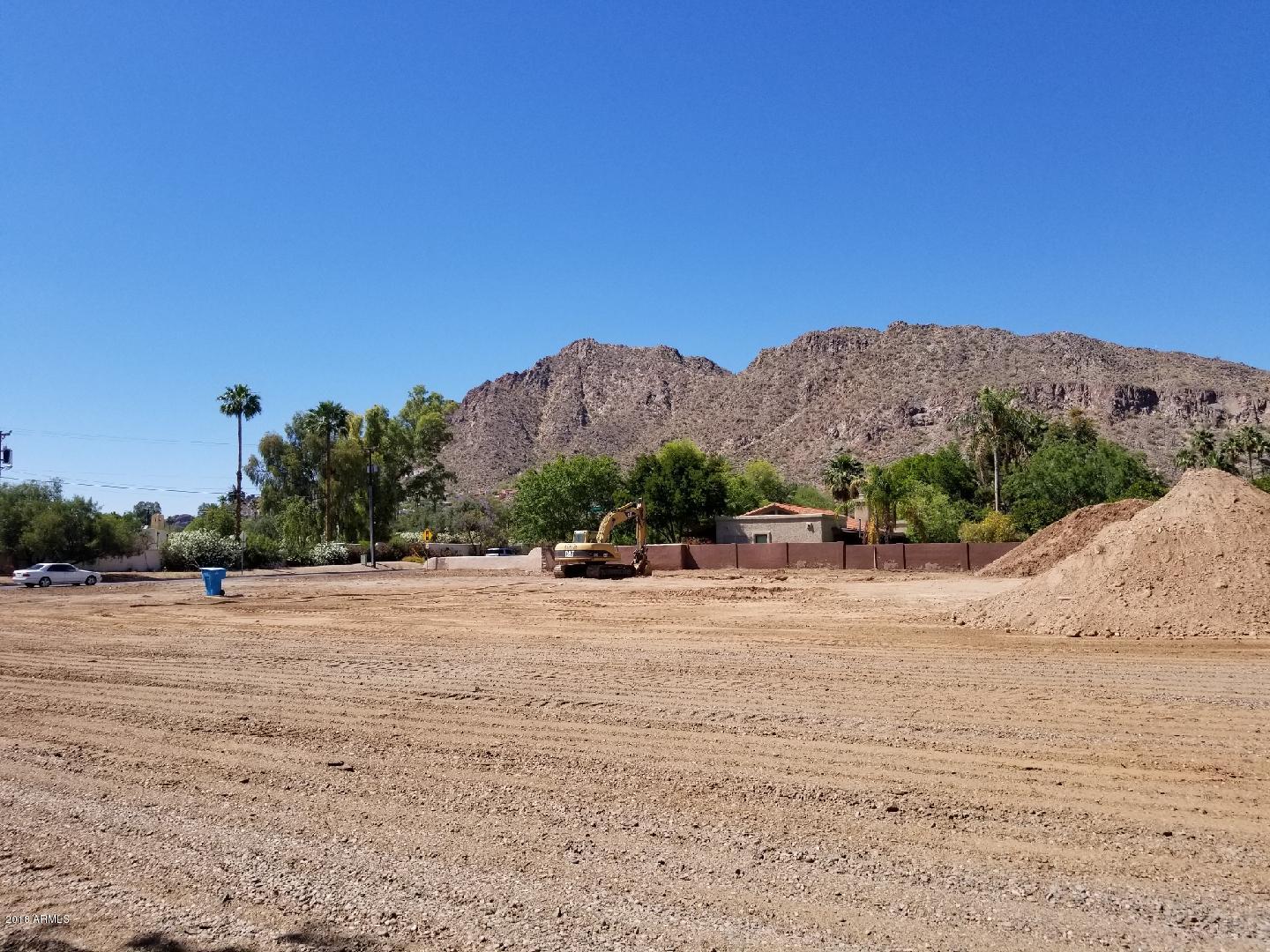 Rare opportunity to own 1 acre parcel located in coveted Arcadia Proper. This lot has stunning views of Camelback and offers endless potential to design and build. Plans are underway for a 5,950 sf home with 4 beds, 5 1/2 baths, dining, office, 6 car garage, large master suite, and plenty of covered patio. Add a guest/pool house, a batting cage, sport court, resort style pool, tennis court, -you name it! Walking distance to the Phoenician and around the corner from other luxury resorts. This property is centralized to some of the valley's best dining & entertainment hot spots, and just minutes away from Old town, the Biltmore, Fashion Square, downtown Phoenix and Sky Harbor. Draft Floor plan & Elevations in docs section. Lot may be purchased separately with no commitment to seller to build