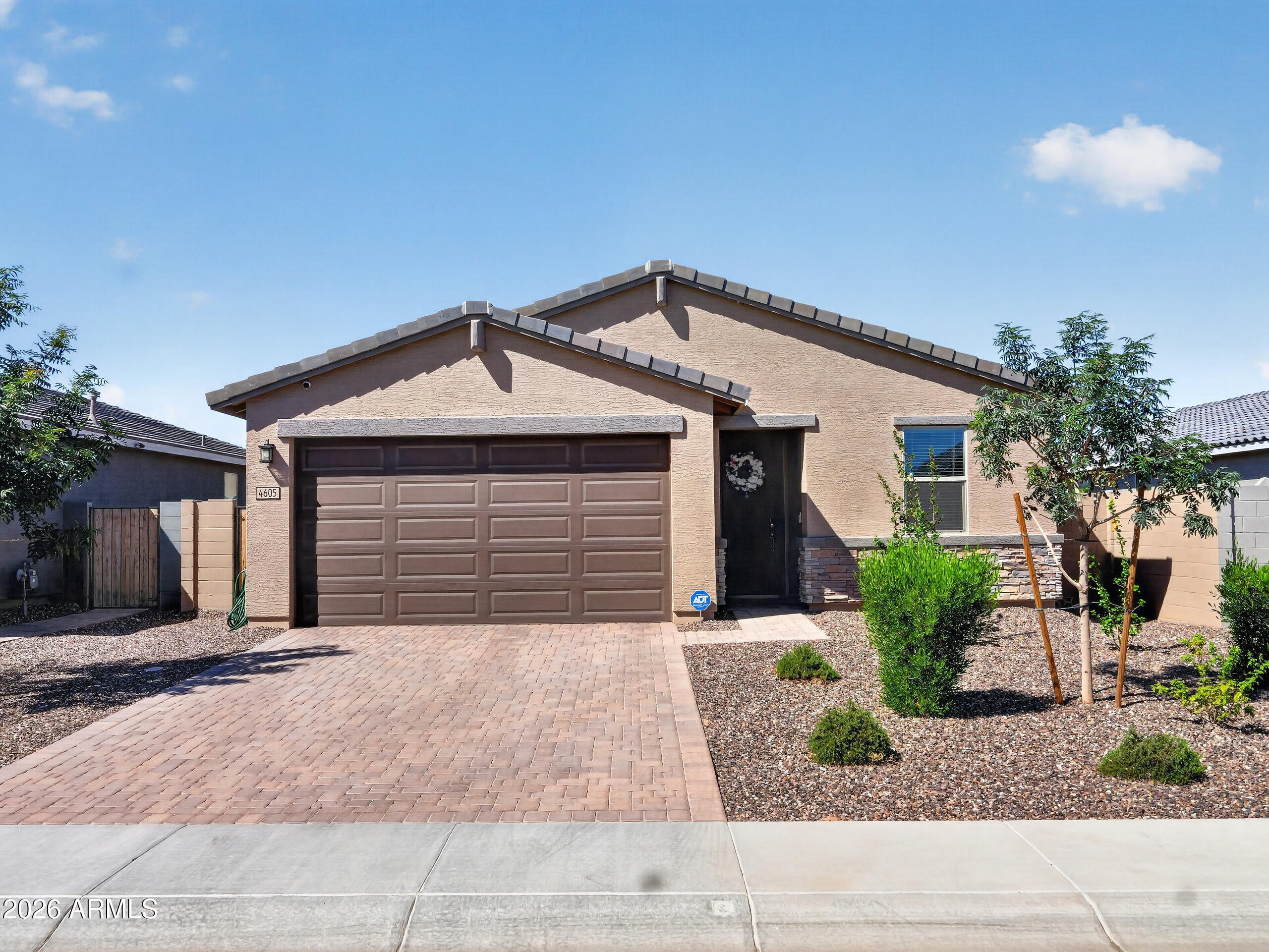 Barely lived in and better than new, this beautifully maintained 4 bedroom, 2 bath home offers modern style, comfort, and convenience on a premium lot with breathtaking views of the San Tan Mountains. The thoughtfully designed open-concept floor plan features a spacious primary suite, generous secondary bedrooms, and seamless living spaces perfect for both everyday living and entertaining. Step outside to a fully landscaped backyard complete with irrigated flower beds, providing a private outdoor retreat that's ready to enjoy. Skip the wait and added expense of new construction, this move-in-ready home already has the finishing touches you've been looking for while offering the feel of brand new.
