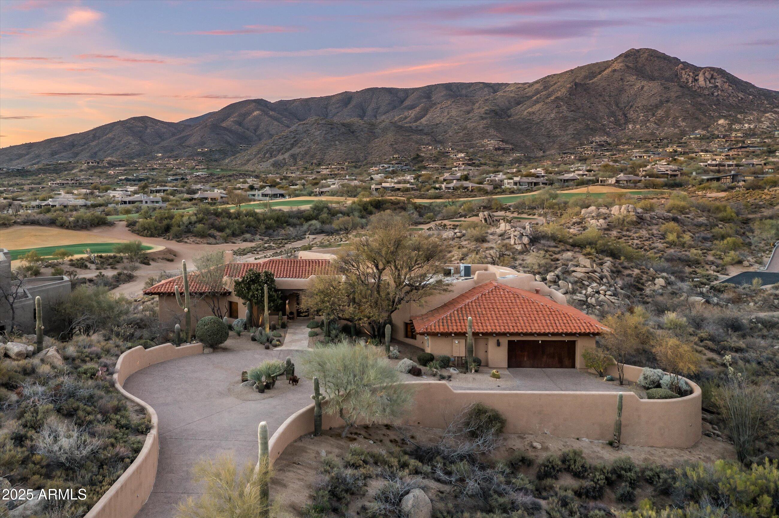 Price Reduced.  VIEWS, VIEWS, VIEWS. GOLF MEMBERSHIP AVAILABLE.. Great home in the village of Rose Quartz at Desert Mountain. Enjoy fabulous views of classic Arizona sunsets, the Continental mountains and golf course.
Four en-suite bedrooms and a half bath. Functional kitchen opens to a charming hearth room and also has access to the main family room. The large patio features a pool, spa, built in bbq and two fire features. Additionally there is a large covered dining area. The home also is equipped with solar. All furniture is available by separate agreement.