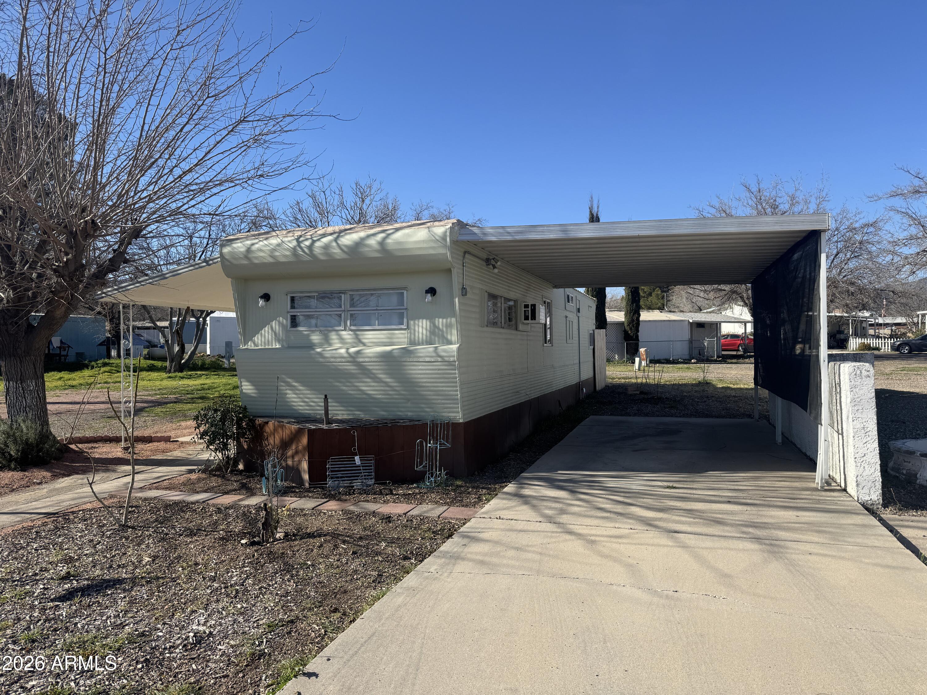 This beautifully remodeled mobile home offers big upgrades in a compact , efficient foot print. Situated on a desirable corner lot, the home enjoys added openness and space, with a new custom back fence providing privacy not common to other homes in the complex. The interior has never been lived in since renovation, and it features brand new unused fixtures throughout, including a new tub/shower, faucets, toilet and new flooring throughout the home. Updates also include new interior ad exterior paint, a new roof, all new electrical wiring, and updated plumbing, along with refreshed kitchen and bathroom spaces. Most windows are new, new exterior plumbing has been added for outdoor water access. This move in ready offers peace of mind! Listing agent is related to seller