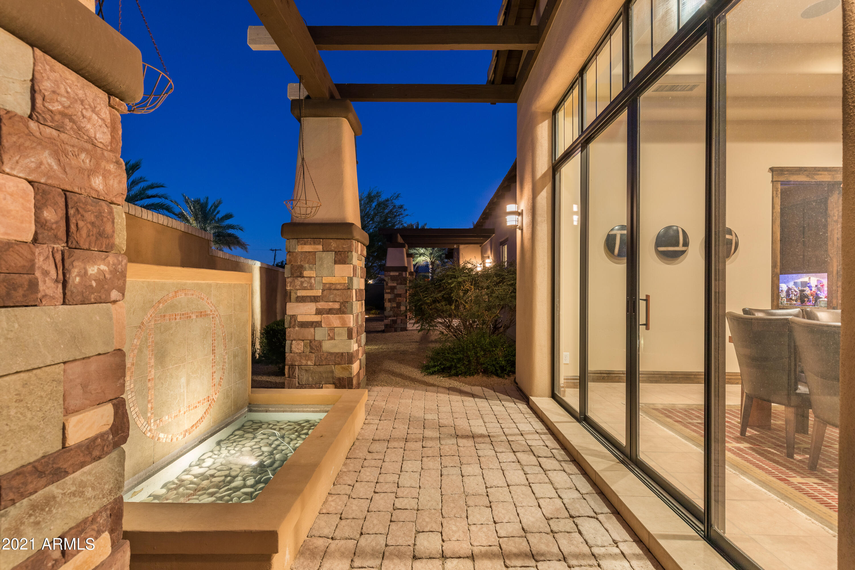 From the architect/designer Ernesto Garcia!  Camelback Mountain views are framed in your private zen-like garden/backyard.  Soft contemporary/transitional clean lines with 9-ft-sliding glass doors brings the outdoors inside.  The design of this home is throughout in glasswork, tranquil reflecting pools in an open concept great room floor plan.  Chef's kitchen with serving bar/butler's pantry/wine & custom warm cabinetry/granite countertops.  Split primary suite/dedicated office/spa-bath & dual vanities/wi-shower/tub.  Crestron smart home system/cameras/& statues convey with property.  3CG/epoxy/custom cabinetry AND FULLY DETACHED GUEST HOUSE.  NO HOA.