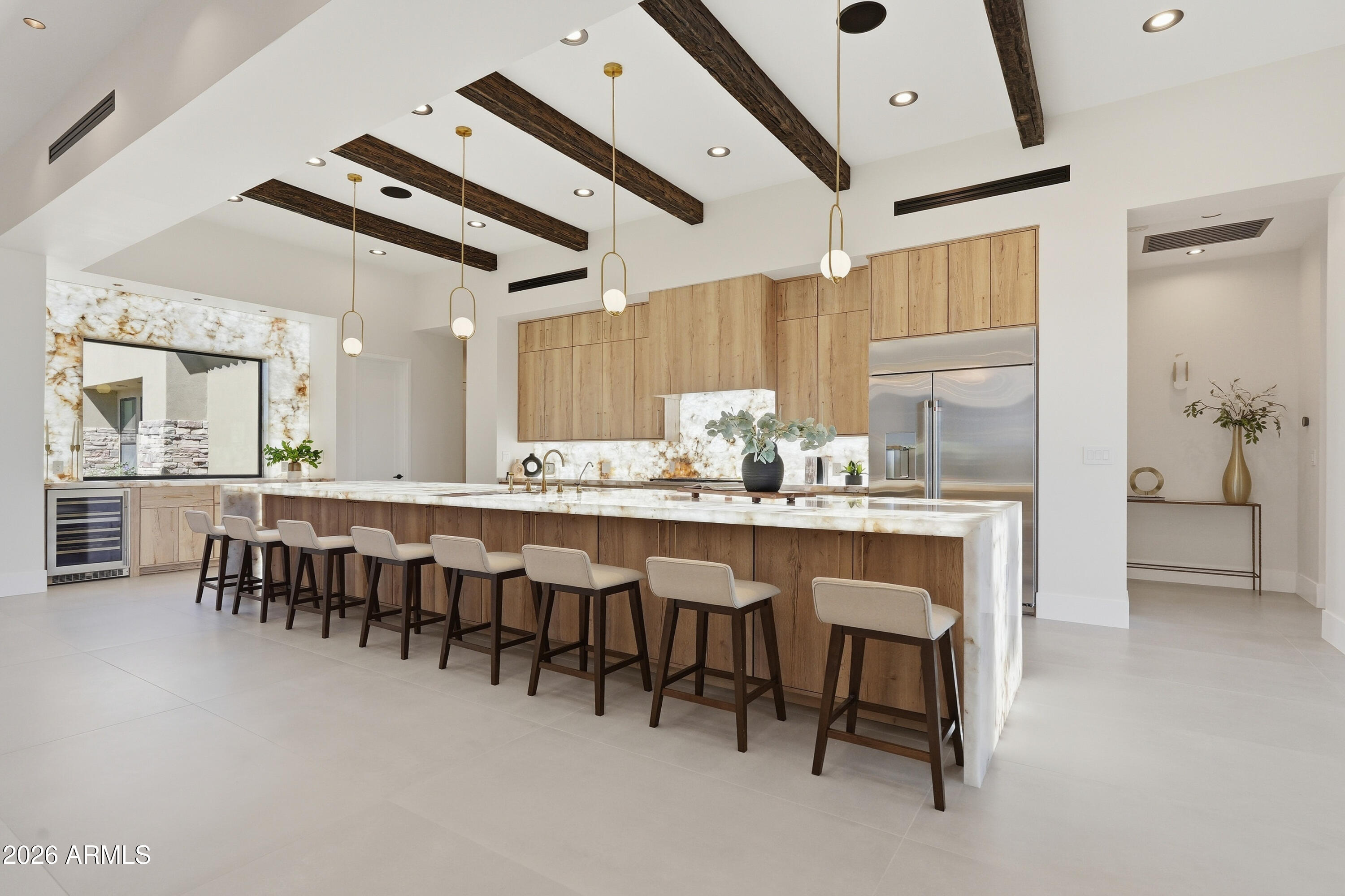 Brand new custom estate on 1.16 acres in a gated community. This stunning single level 5 bed, 4.5 bath home delivers 4,774 SF with cathedral ceilings, exposed beams, and multi slide glass doors framing panoramic mountain views. The kitchen showcases a cultured marble waterfall island, wood cabinetry, and professional grade appliances open to the great room with modern linear fireplace. Entertain in the formal dining or game room. Primary suite with hardwood floors, floor to ceiling windows, spa bath with his and hers toilets, and custom walk in closet. Two ensuite bedrooms plus Jack and Jill bath for guests. Resort backyard with sparkling pool, water features, and finished landscaping beneath a covered patio. Whole home smart technology with bluetooth speakers, 3 car garage, and RV gate.