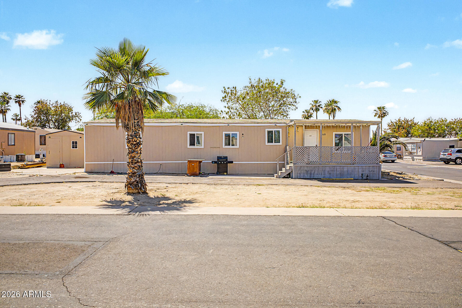 Discover all the charm of this adorable 3-bedroom mobile home! The interior boasts wood-look flooring, vaulted ceilings with exposed beams to add character, plenty of natural light, and a soothing palette that makes you want to stay. The kitchen comes equipped with recessed lighting, white shaker cabinets, ample counter space, a walk-in pantry, and built-in appliances for a seamless cooking experience. Relax after a long day in the main retreat, complete with a full bathroom with double sinks and a separate shower & tub for added privacy and comfort. Spacious storage shed out back for extra organization. Don't miss out on the community's amenities, including the pool, sports court, and playground! Welcome home!