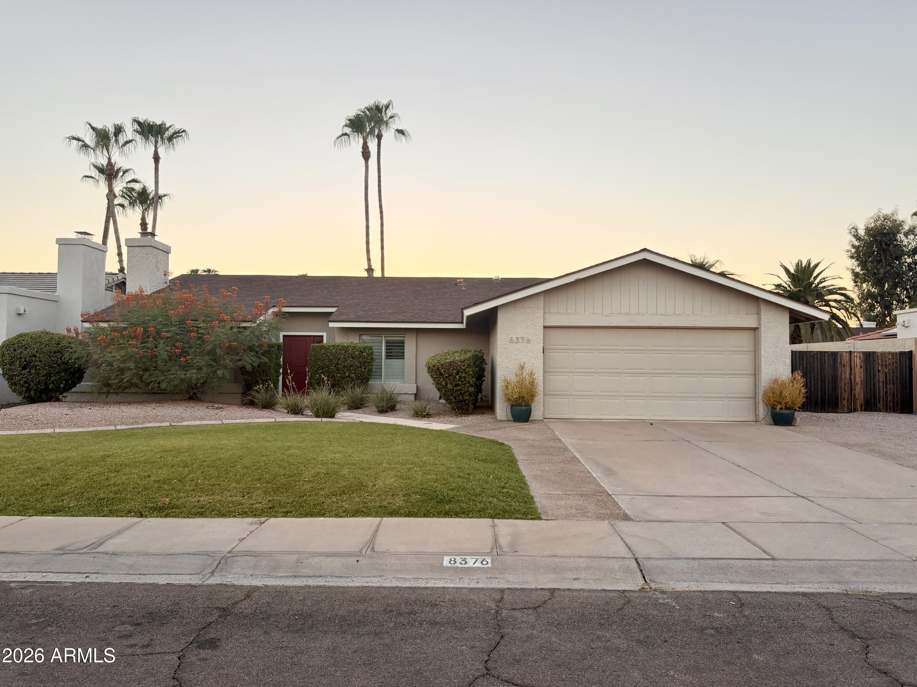 Beautifully updated home in the heart of McCormick Ranch featuring quality craftsmanship throughout. The spacious kitchen offers abundant cabinetry, granite countertops, a breakfast bar, and stainless-steel appliances and NEW AC! Hand-scraped wood floors, a cozy fireplace, and abundant natural light creating an inviting atmosphere. The primary suite includes a walk-in closet and beautifully updated bath, while the fourth bedroom with French doors makes an ideal home office or den. Enjoy a private backyard retreat with a large covered patio, grassy area, pool with water feature, and side yard with RV gate access. Surrounded by single-story homes for added privacy and conveniently located near the Greenbelt, Mountain View Park, Cochise Elementary, popular restaurants, and local coffee shops.