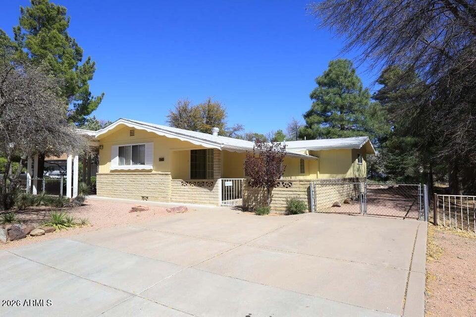Charming Payson Home with Income-Generating Potential Welcome home to this beautifully updated, traditional wood-frame residence nestled on a generous 9,500 sq. ft. lot. Located in the heart of Payson, this property offers a rare opportunity for flexible living--perfect for multi-generational needs or generating supplemental rental income to help offset your mortgage. The main home features a functional 2-bedroom, 1-bath layout plus a versatile den, ideal for an office or hobby room. Recent renovations have revitalized the space, featuring: Stunning water-resistant laminate wood flooring, Brand-new interior paint creates a fresh, inviting atmosphere. Beautifully refinished white cabinetry paired with stainless steel appliances. Recently updated HVAC system and new roof in 2023. Maximize your investment with the detached, updated guest house. Whether you need a private space for visiting guests or a
long-term rental, this separate structure provides the privacy and convenience modern tenants look for.Situated in the heart of the city, you are just moments away from the best shopping and entertainment that Payson has to offer. Don't miss this unique chance to own a move-in-ready property with built-in income
potential! Guest house is 720 Square feet.Home is 1,184 square feet .
