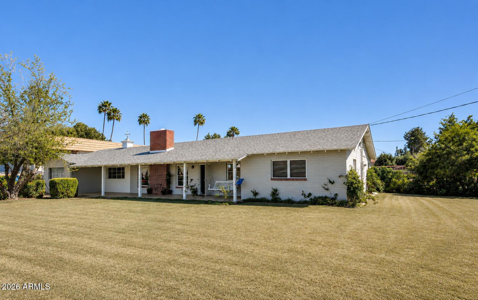 Rare opportunity to own nearly ¾ of an acre in the heart of Mesa with no HOA! This spacious property offers approximately 2,500+ square feet, 5 bedrooms, 2 bathrooms, and a versatile floor plan designed for multi-generational living, home-based business use, or those simply seeking room to spread out. Situated on an expansive lot, the property features a large, fenced diving pool, mature landscaping, irrigation, abundant parking, and endless possibilities for future expansion. The detached storage/workshop area and substantial underground basement/cellar space provide exceptional storage and flexibility. Recent improvements and upgrades have enhanced the home's functionality while preserving its solid block construction and character. Conveniently located near shopping, dining, schools, parks, Hohokam Stadium and freeway access, this unique property combines the space and privacy of a rural setting with the convenience of city living. Currently holds a group home certificate of occupancy for up to 10 beds--A rare find with unlimited potential in a highly desirable Mesa location!