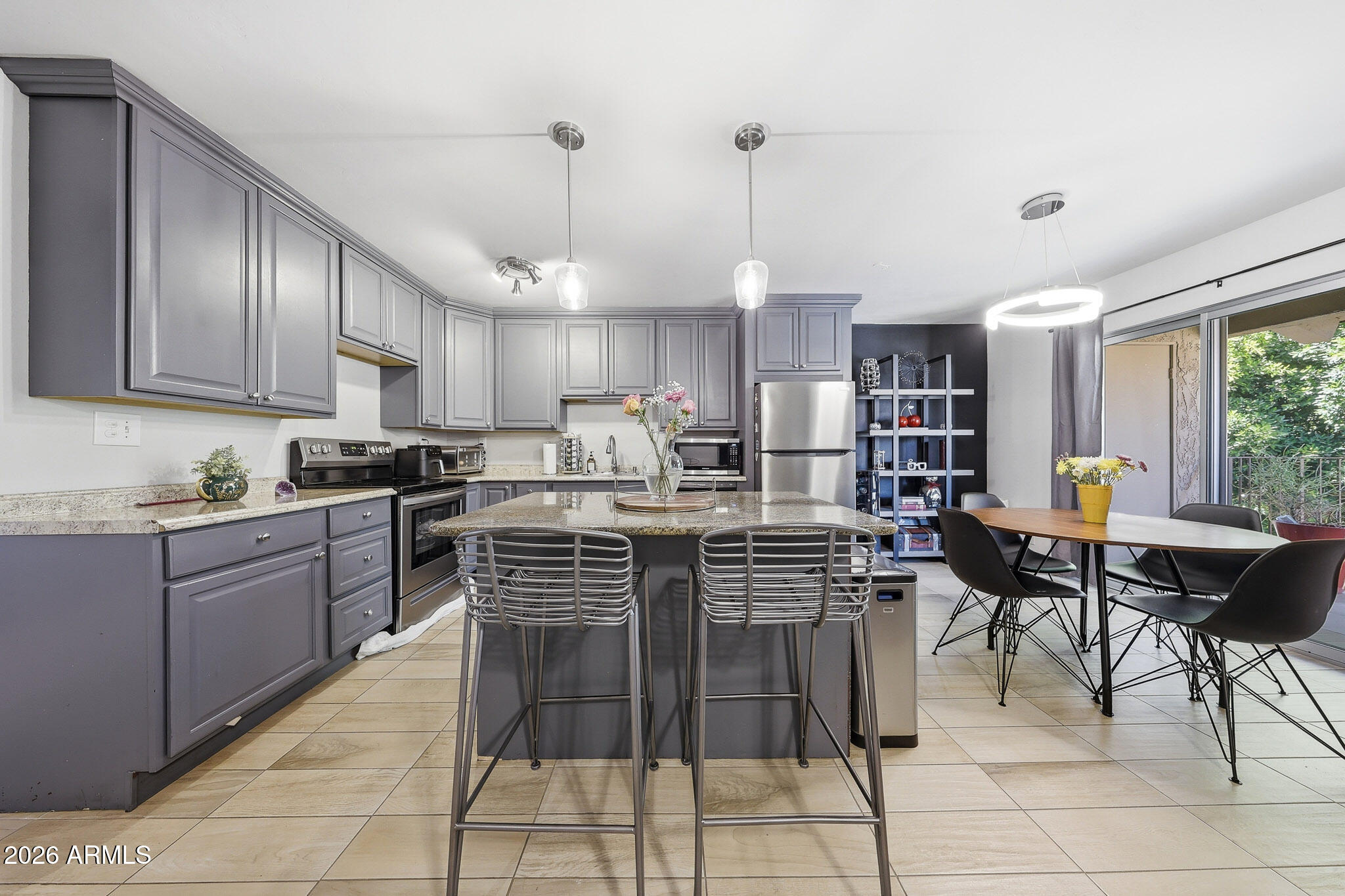 Turn-key and fully furnished, this beautifully updated 2 bed, 2 bath condo in the highly sought-after Arcadia area offers effortless, low-maintenance living. The open-concept floor plan is enhanced by updated tile flooring, ceiling fans throughout, and a Trane AC system for year-round comfort. The remodeled kitchen features custom cabinetry and a clean, modern design. Enjoy your private patio or unwind at the community's heated pool, spa, clubhouse, and fitness center. Ideally located just minutes from Old Town Scottsdale, Scottsdale Fashion Square, premier dining, art galleries, and vibrant nightlife. A perfect full-time residence or lock-and-leave opportunity.