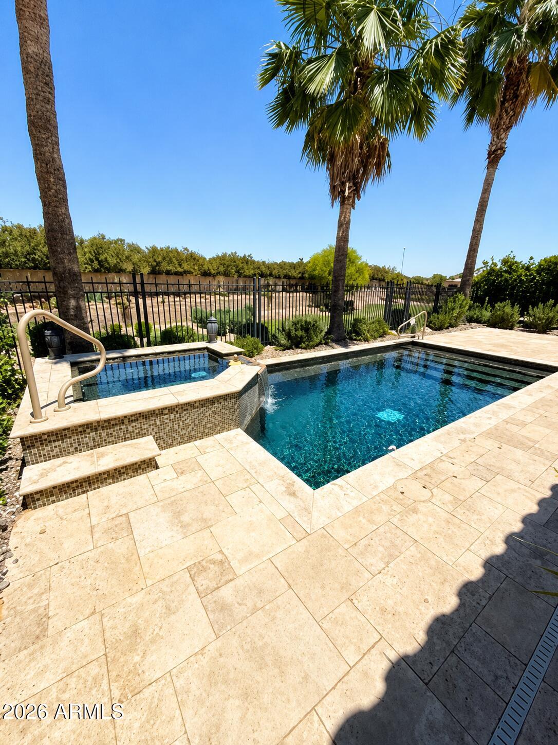 Tucked away on a rare cul-de-sac view lot in Encanterra, this Monaco Floor plan home offers something buyers rarely find, privacy, resort-style outdoor living, and no direct neighbors behind. Beyond the front courtyard, the home opens into a layout designed to feel both inviting and effortless, but it's the backyard that may stop buyers in their tracks.
Framed by open views and backing to the adjacent park, the retreat-style setting features a heated pool and spa, travertine decking, built-in BBQ, and a fireside patio built for Arizona evenings. Inside, bay windows fill the kitchen with natural light, while the breakfast nook, oversized island, and built-in beverage fridge create a space that feels both warm and elevated. Enjoy the privacy, views, and outdoor experience this home offers.