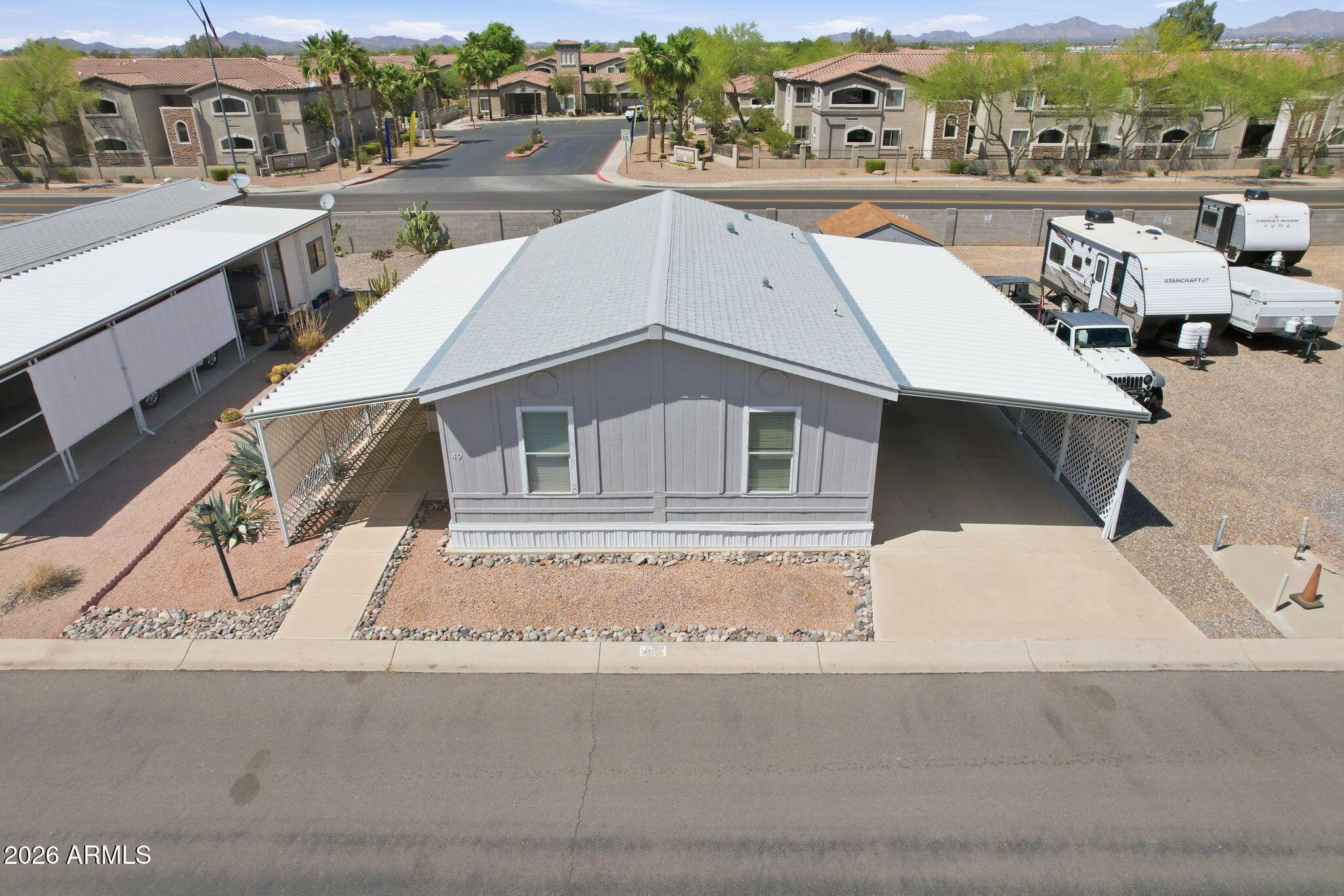 Seller offering 3 months paid land lease with acceptable offer! Enjoy resort-style living in Sunwest Resort Village, a sought-after 55+ active adult community in Casa Grande. This turnkey, beautifully updated 3-bedroom, 2-bath home features a bright open layout, remodeled kitchen with modern appliances, refreshed cabinetry, generous counter space, new flooring, updated fixtures, and fresh interior paint. Split floor plan offers comfortable bedrooms and ample storage. Relax outdoors with low-maintenance landscaping and covered parking. Community amenities include a pool, spa, clubhouse, fitness center, billiards, shuffleboard, planned activities, and BBQ area. Perfect for full-time or seasonal living!