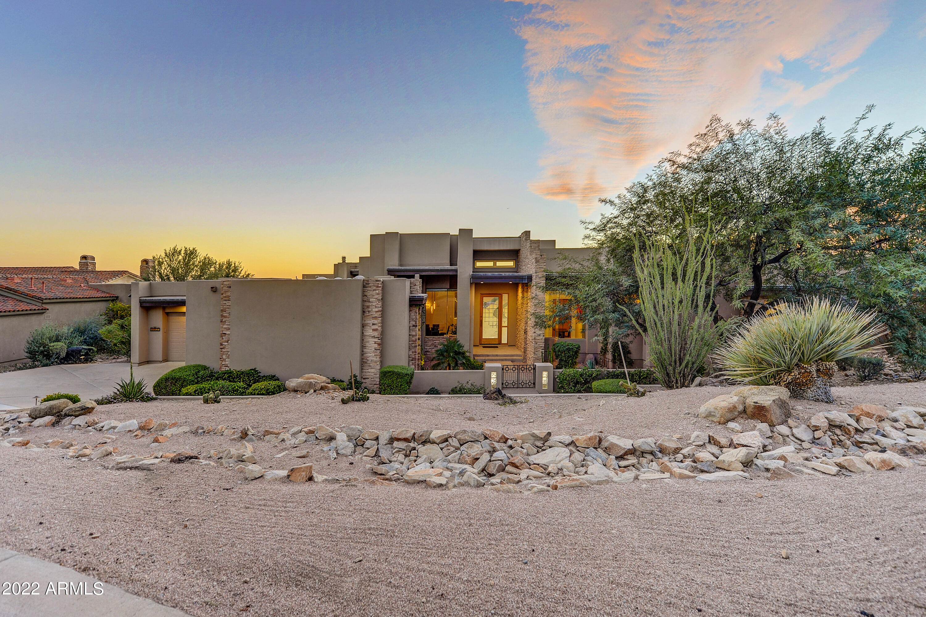 The moment you walk through the front door, your eyes are drawn to the view of Camelback Mountain & the Phoenix Valley. Soaring ceilings & expansive windows invite you into the living space filled with natural light & exquisite contemporary décor. Entertain in style in the elegant formal dining room or enjoy casual gatherings in the spacious family room that is open to the gourmet kitchen & breakfast room. A wall of sliding glass doors opens from the family room to the private covered patio. A negative edge pool with water & fire features, spa & fireplace provide endless opportunities to enjoy Arizona's outdoor lifestyle, amazing sunsets, and incredible vista views. The large master suite features a cozy gas fireplace & captivating views from the wall of sliding glass doors. A luxurious master bath with jacuzzi tub, walk-thru shower & dual vanities adjoins a fitness room & sauna. Two ensuite bedrooms with individual climate control are split from the master suite & share a private patio. The large den/office with ensuite bath can be used as a 4th bedroom. Tastefully decorated & impeccably maintained, this lightly lived in single level home in prestigious Ancala Country Club is the perfect desert retreat. Most furnishings are available on a separate bill of sale.

Nestled in the shadows of Scottsdale's majestic McDowell Mountains with breathtaking views of the Phoenix Valley, Ancala offers an unparalleled lifestyle experience. The Ancala Country Club golf course and clubhouse are the centerpiece to this prestigious guard-gated community. In addition to the championship golf course, considered to be one of the best in the state, club amenities include lighted tennis courts, state of the art fitness center, community pool, dining & year-round social events.  Country Club membership is optional.