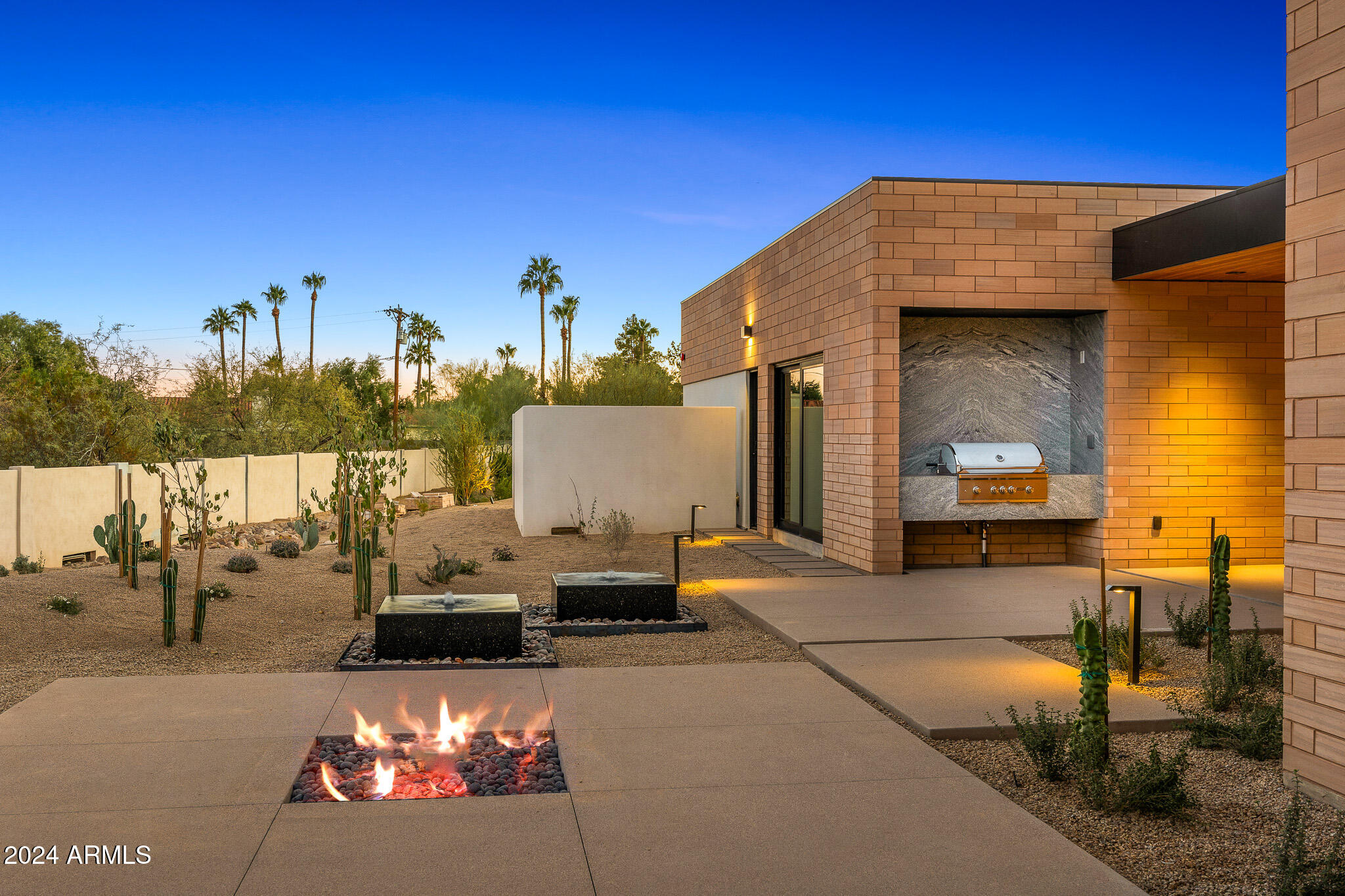Nestled just north of downtown Scottsdale, Palo Verde Lane is a unique desert modern community that blends architecture with the natural beauty of the desert. This final home sits on a nearly 0.5 acre lot, featuring a 3-car garage, 3 spacious ensuite bedrooms, an office, and a gym. Its design combines the warmth of wood, the permanence of masonry, and the openness of glass, offering both privacy and connection to nature. Just steps from upscale dining and shopping, the home honors its desert heritage and fosters neighborliness, making it a rare opportunity to own in this coveted community.