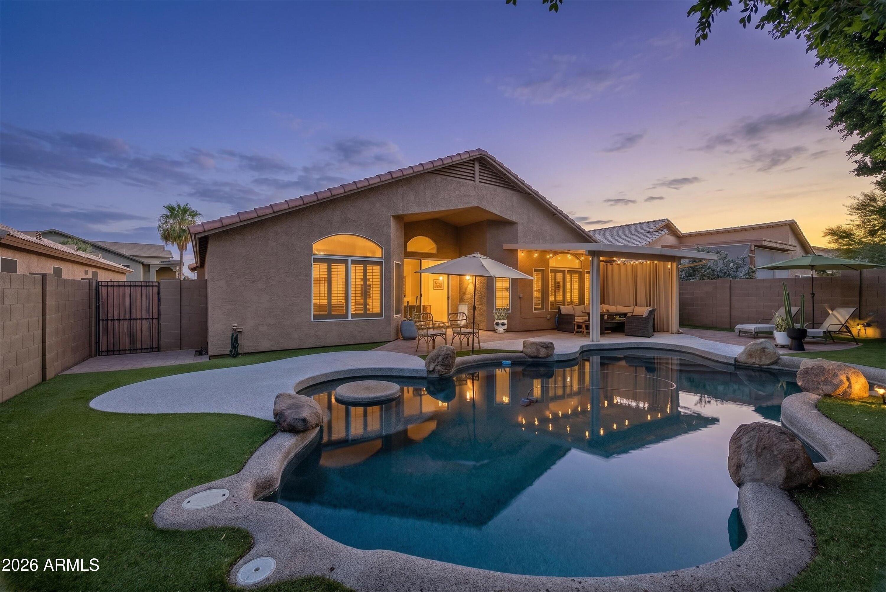 Thoughtfully updated and meticulously maintained, this single-level home in Ahwatukee's Foothills Paseo community offers 4 bedrooms, 2 bathrooms, and 2,225 square feet of inviting living space. Vaulted ceilings, abundant natural light, designer feature walls, wood slat accents, and updated flooring create a modern aesthetic that sets this home apart.

The open-concept layout flows seamlessly between the living, dining, and kitchen areas, making everyday living and entertaining effortless. Both the primary and guest bathrooms were extensively renovated in 2025 with custom cabinetry, quartz countertops, designer tile work, upgraded fixtures, and contemporary finishes.

Outside, a private backyard retreat awaits. Surrounded by mature trees and lush landscaping, the outdoor space features PebbleTec pool, premium RubberStone pool decking, artificial turf, paver patios, and a spacious covered entertaining area designed for year-round Arizona living.

Additional improvements include a new roof installed in 2024 and overhead garage storage racks that convey. Ideally located near South Mountain hiking and biking trails, shopping, dining, highly regarded schools, and convenient Loop 202 access, this home offers the perfect combination of comfort, style, and Ahwatukee living.