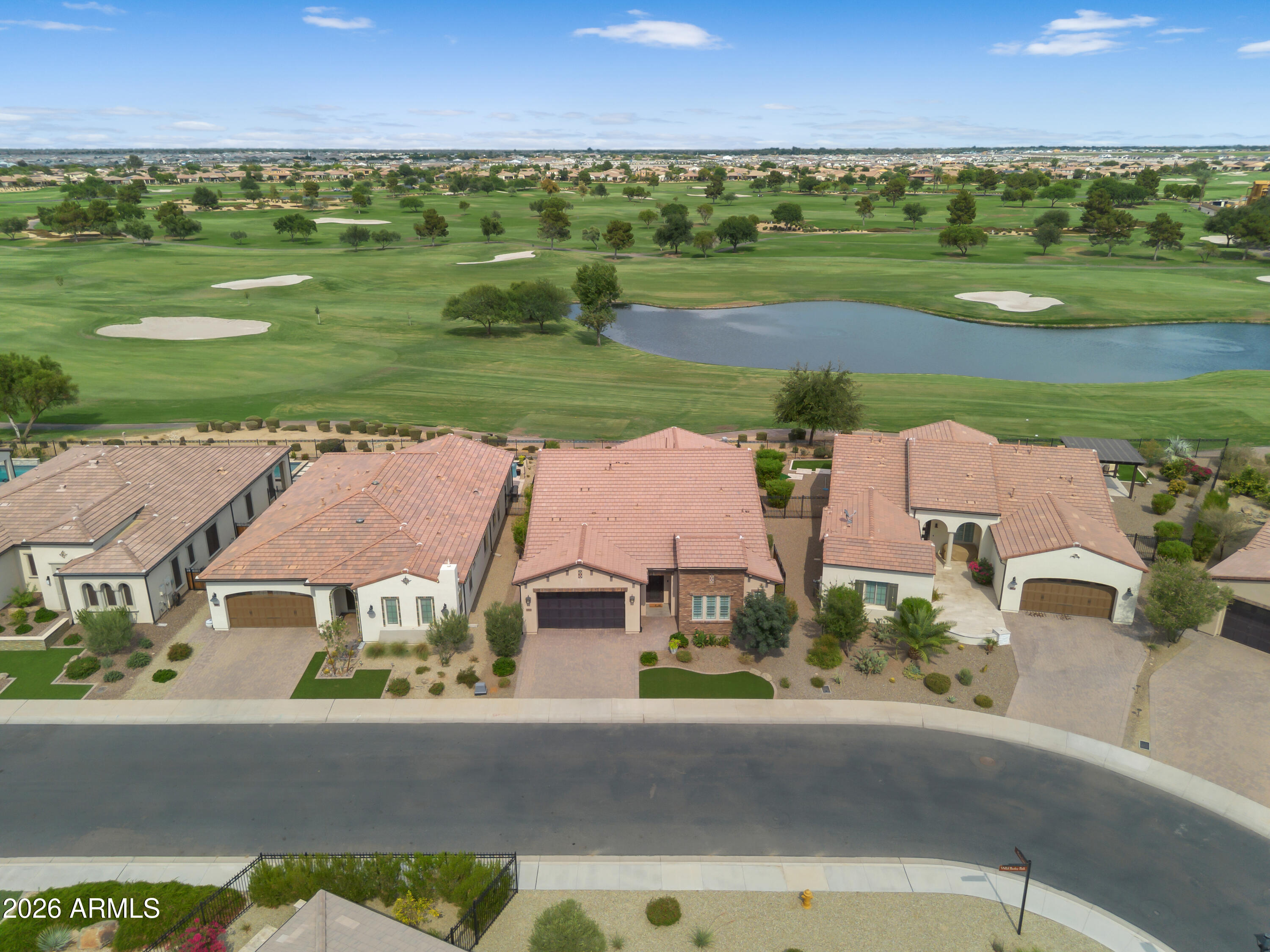 Welcome to one of the most exceptional opportunities available in Encanterra Golf & Country Club. Perfectly positioned on what many consider to be one of the community's premier homesites, this stunning Create model captures breathtaking panoramic views across three fairways, a tranquil water feature, and the signature 17th hole of the private Tom Lehman-designed championship golf course.

Built in 2022 and meticulously maintained, this beautifully upgraded home offers 3 bedrooms, 3 full bathrooms, and one of Encanterra's most sought-after floor plans. Thoughtfully designed for both everyday living and effortless entertaining, the open-concept layout is filled with natural light and seamlessly blends spacious interior living with spectacular outdoor spaces.

A standout feature of this is the expansive front guest suite, offering the feel and privacy of a second owner's retreat. With its generous square footage, luxurious en suite bath, and walk-in closet, it's an ideal space for long-term guests, multigenerational living, or anyone who appreciates exceptional comfort and privacy.

At the center of the home, the chef's kitchen is designed to bring people together, featuring an oversized island, abundant workspace, premium finishes, and an effortless connection to the great room and dining area. Beautiful tile flooring throughout adds both elegance and easy maintenance, while the versatile flex room provides endless possibilities as a home office, media room, fitness space, or hobby room.

Step outside and discover what truly sets this property apart. The resort-style backyard was designed to showcase one of Encanterra's most remarkable golf course settings. Relax year-round in the heated pool and spa while enjoying sweeping fairway views, shimmering water, unforgettable Arizona sunsets, and the peaceful beauty of the 17th hole.

Beyond the home itself, you'll enjoy the award-winning Encanterra lifestyle. Residents have access to the private Tom Lehman-designed championship golf course, exceptional clubhouse dining, resort-style pools, a full-service spa, state-of-the-art fitness center, pickleball, tennis, bocce, miles of scenic walking trails, and an active calendar filled with concerts, social clubs, fitness classes, wine events, and year-round activities that make every day feel like a vacation.

The seller is a current golf member, giving the buyer the opportunity for priority access to acquire a golf membership, subject to club approval. Opportunities to own a newer home on one of Encanterra's premier golf course homesites, combined with panoramic views and priority access to golf membership, are exceptionally rare.

This is more than a beautiful home. It's an opportunity to embrace one of Arizona's premier private club lifestyles in a setting that is truly difficult to duplicate.