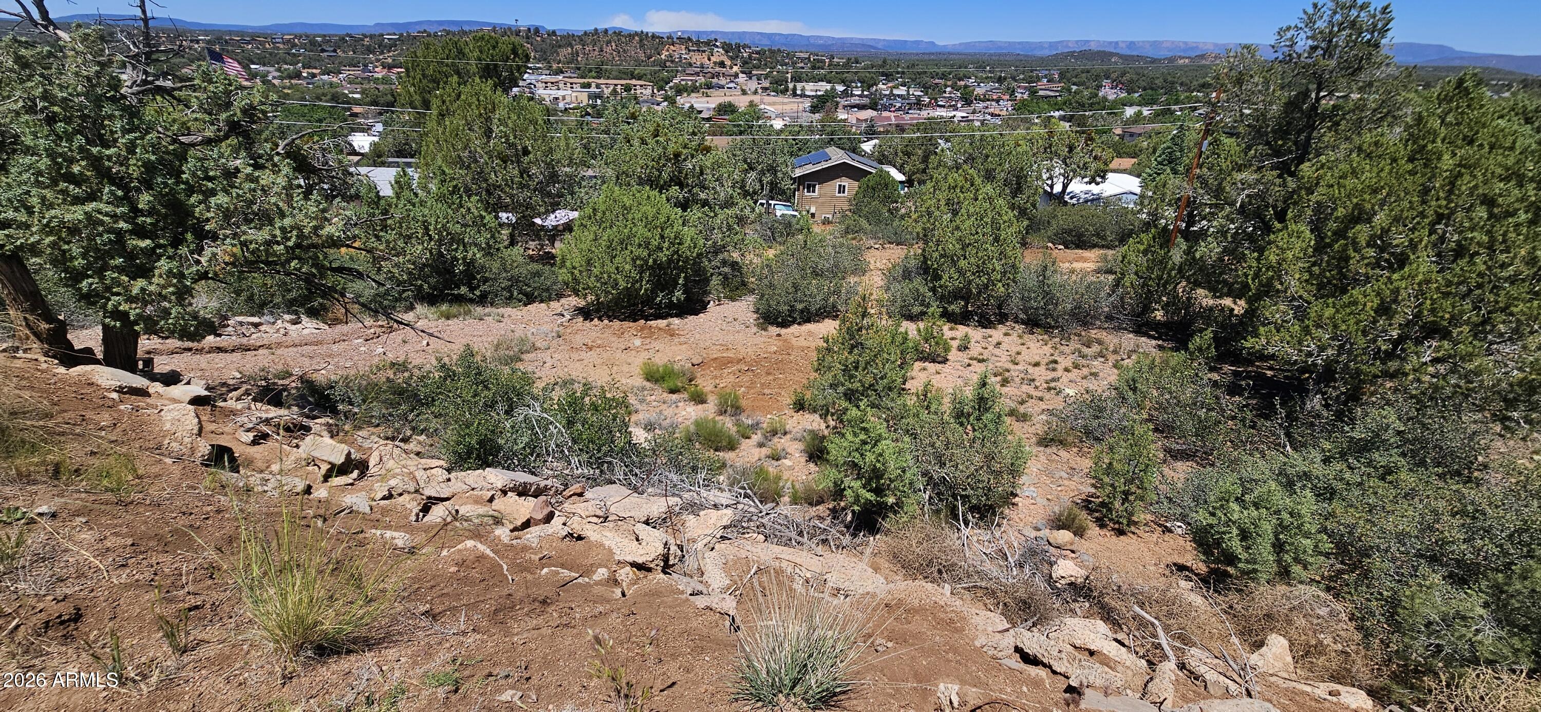 This exceptional .44 acre Lot offers unparalleled opportunity to build your dream home in Payson, Arizona. This being one of the last few lots available to build on in the desirable Pine Ridge neighborhood. Situated with breathtaking panoramic views of the city and the majestic Mogollon Rim, this lot is truly one of a kind. The property is bordered by the Tonto Apache Reservation, ensuring privacy and tranquility, while still being just a short walk to local businesses, restaurants, the Mazatzal Hotel & Casino and the Payson Events Center. Imagine sitting on your back porch, watching unobstructed sunrises and sunsets, with snow-capped mountain range to the North and city lights twinkling below at night. This prime location offers the perfect escape from the heat of the valley, only an hour and a half drive, making it an ideal getaway spot or full-time residence. Don't miss out on this rare opportunity 2 own a piece of paradise - where natural beauty meets modern convenience.