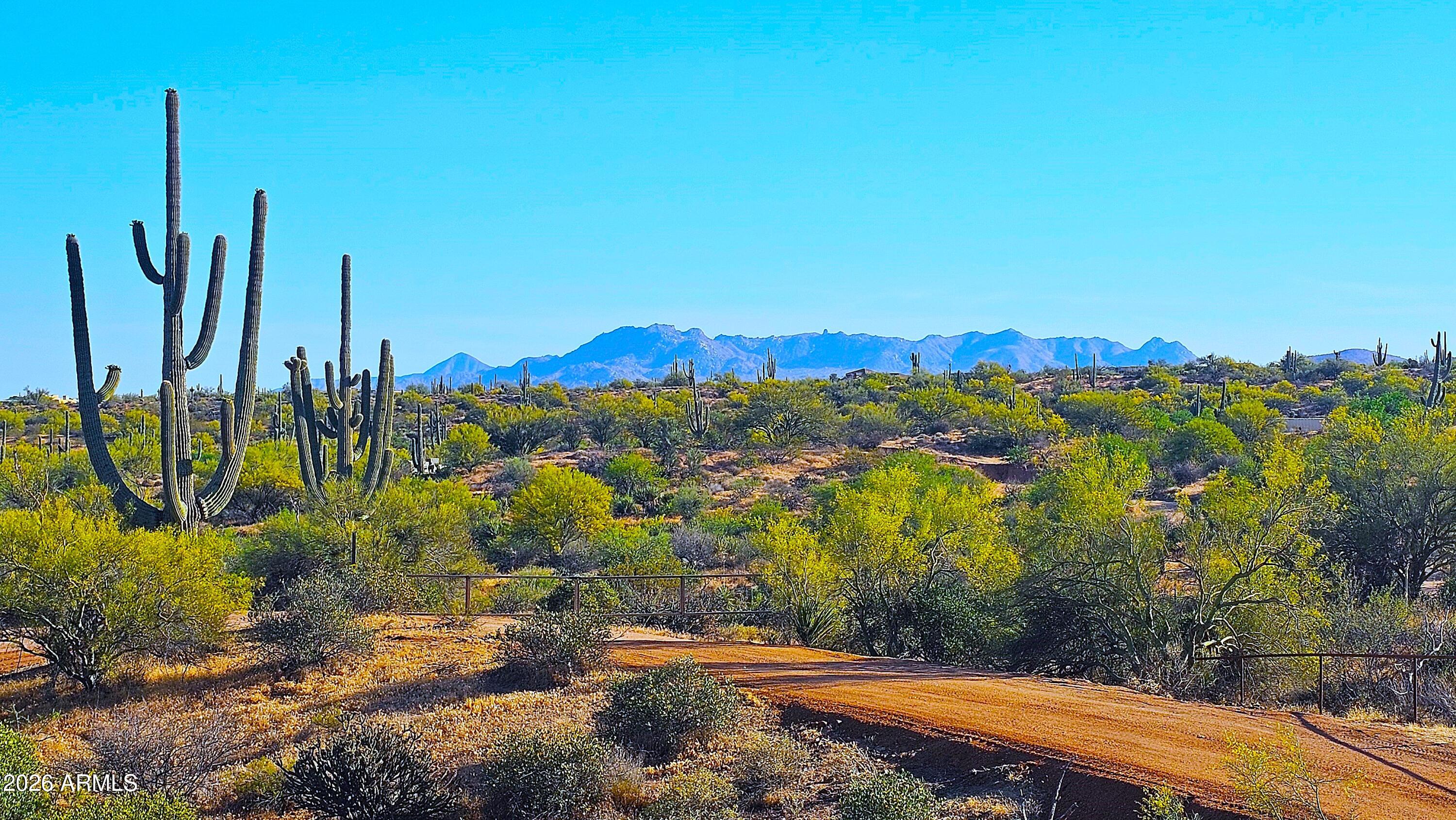 Pristine 2.3 acres bordering the 3.5 million acre Tonto National Forest. Escape the city life! Fenced and gated for ultimate privacy! New, engineered, private drive, leads up to a elevated, homesite, offering 360 degree mountain views! Enjoy cool crisp air, towering 100+ year old Saguaro's, amazing sunrises & sunsets, clear starry nights, distant city light views & lush Sonoran Desert vegetation! Enjoy horseback riding, mt. bike riding, hiking and off road adventures right from your back door. Water wells in area including one next door. Underground power & new homes nearby. Low property taxes, NO HOA! Only minutes from world class golf, fine dining, resorts & shopping. Subject property and surrounding properties deed restricted to 1 house per 2 acres. Don't miss it!