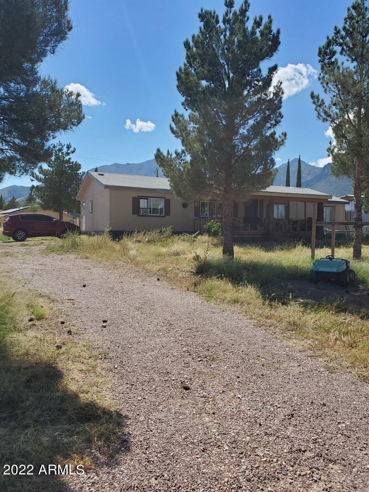 Gorgeous Mountain Views!! 
This 4 bedroom 2 bath home sits on 1 fenced acre with breathtaking mountain views and potential for your dream property. MUST SEE TODAY!! Priced to sell FAST - AS IS SALE!