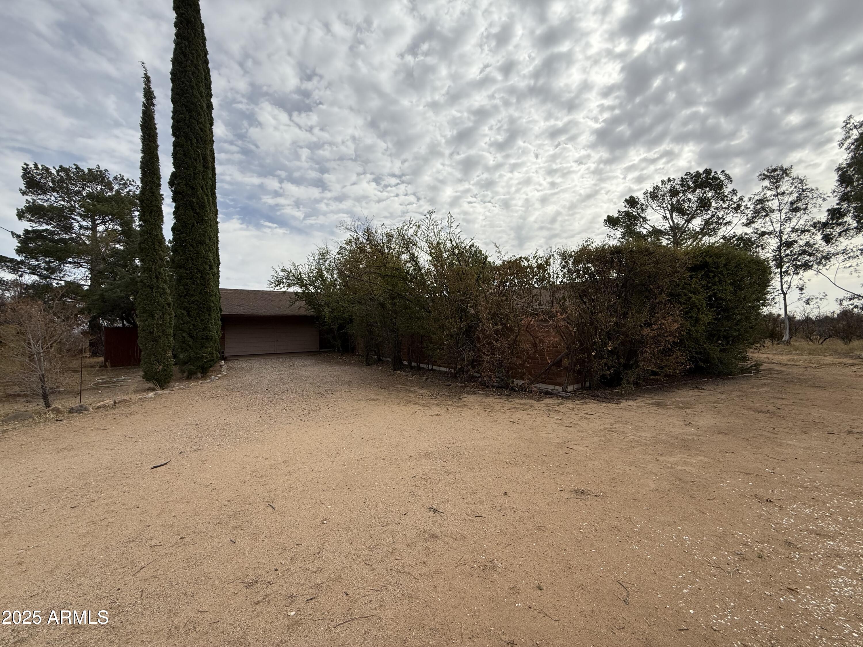 This home was built with many unique features and the best quality at the time. There are lots of windows for great natural light.  There is a large formal dining room with custom maple (I think) cabinetry. The same lovely hardwood flows throughout the home! There is a good size kitchen that is ready to enjoy and looks out over the property to the north. There is a HUGE great room with a beautiful parlor stove and also a large fireplace. The beautiful cedar tongue and groove ceiling really stands out here! There are 4 bedrooms and 3 baths making this a wonderful nexthome for you. There are some outbuildings, fencing and cross fencing and a private well. All these amenities sit on 9 splittable acres. It does needs work but well worth the money!